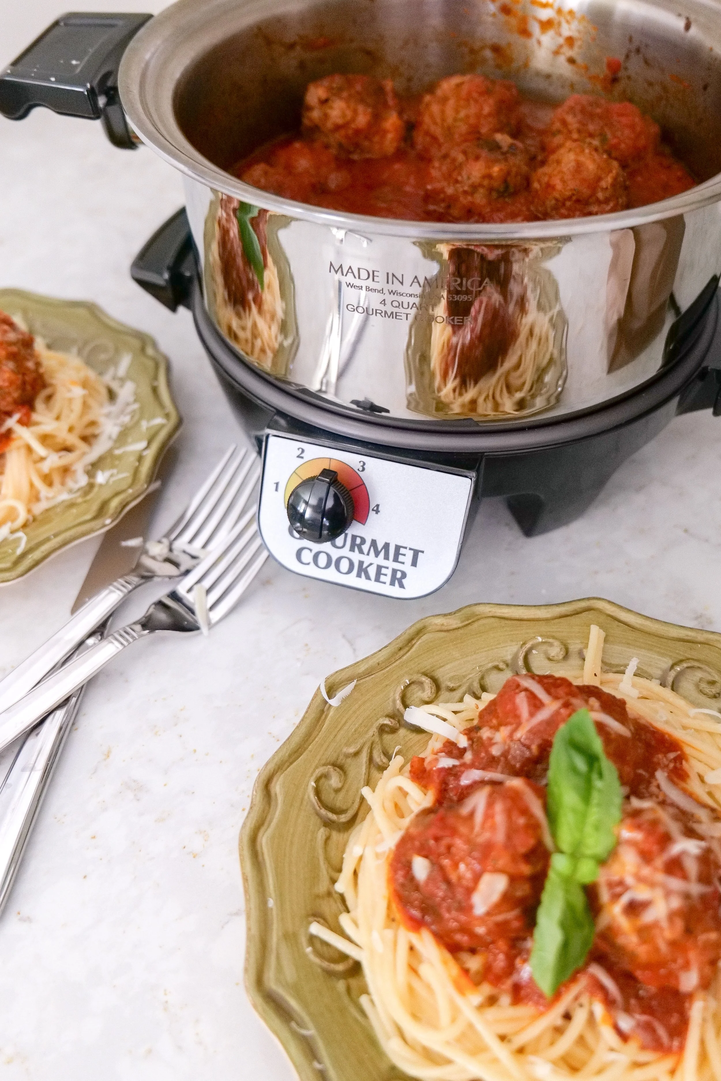 Italian sausage meatballs cooking in a crockpot filled with marinara sauce