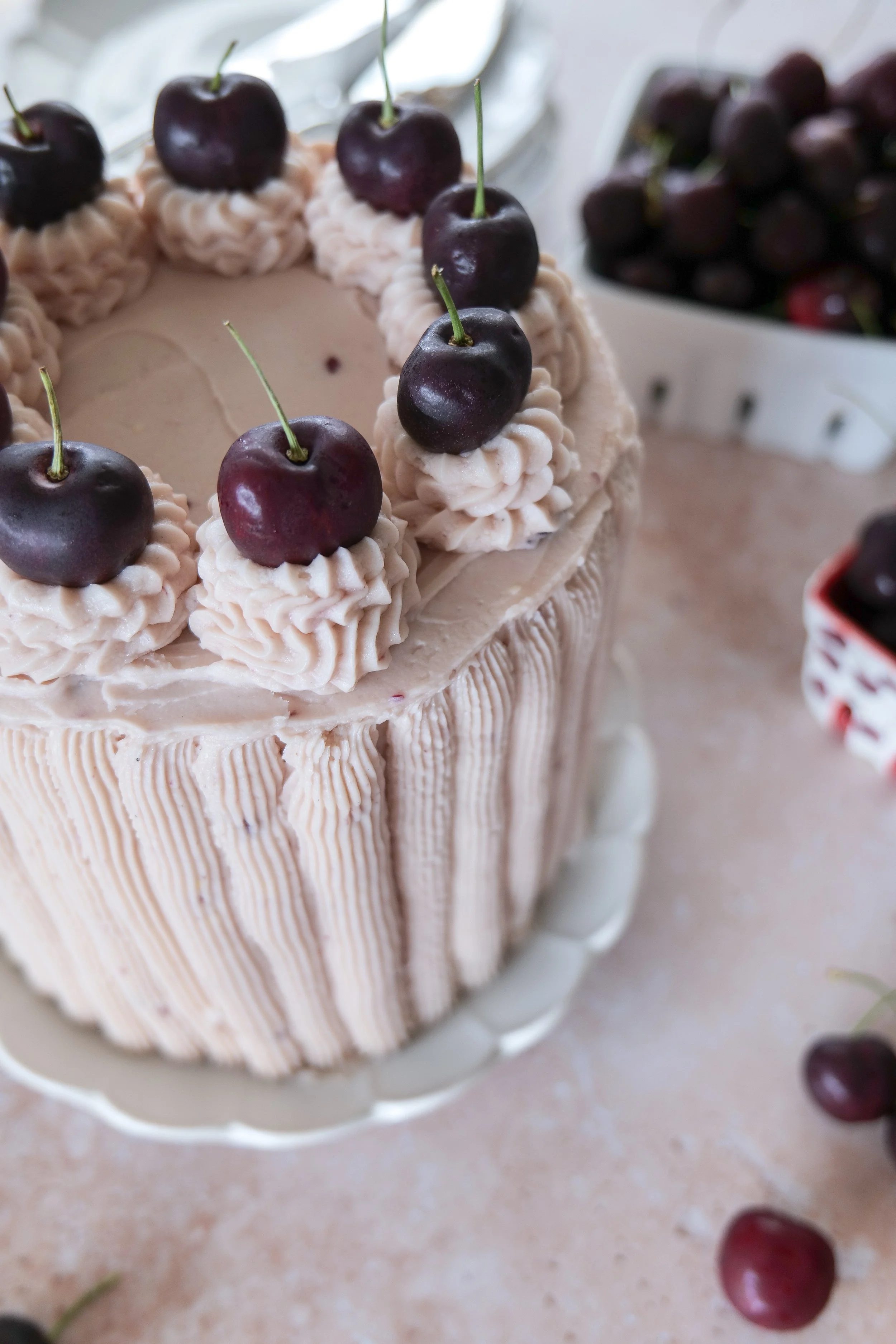 Vanilla bean cake layered with sweet homemade cherry filling and whipped cherry buttercream.