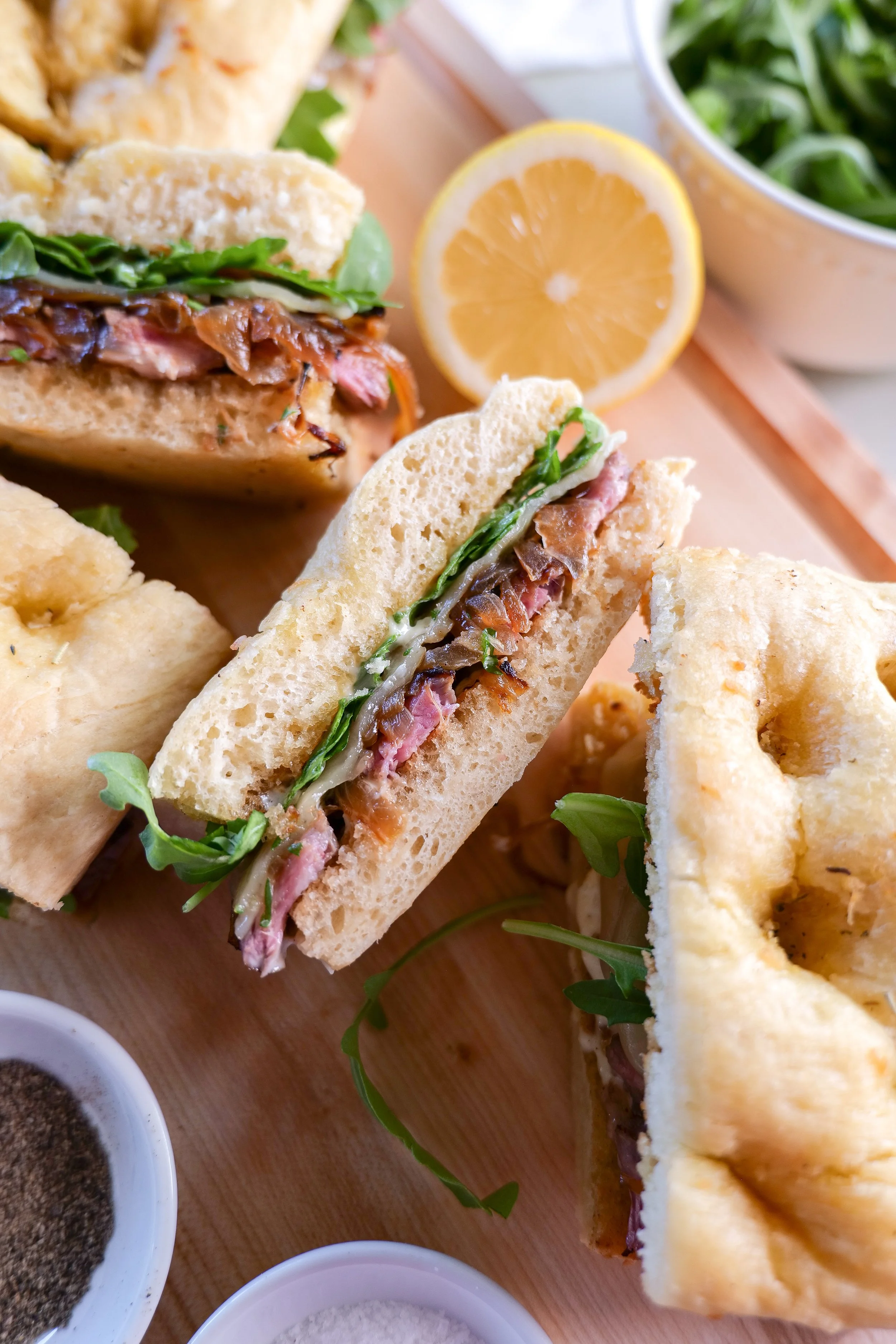 Homemade steak focaccia sandwich with melted provolone and caramelized onions