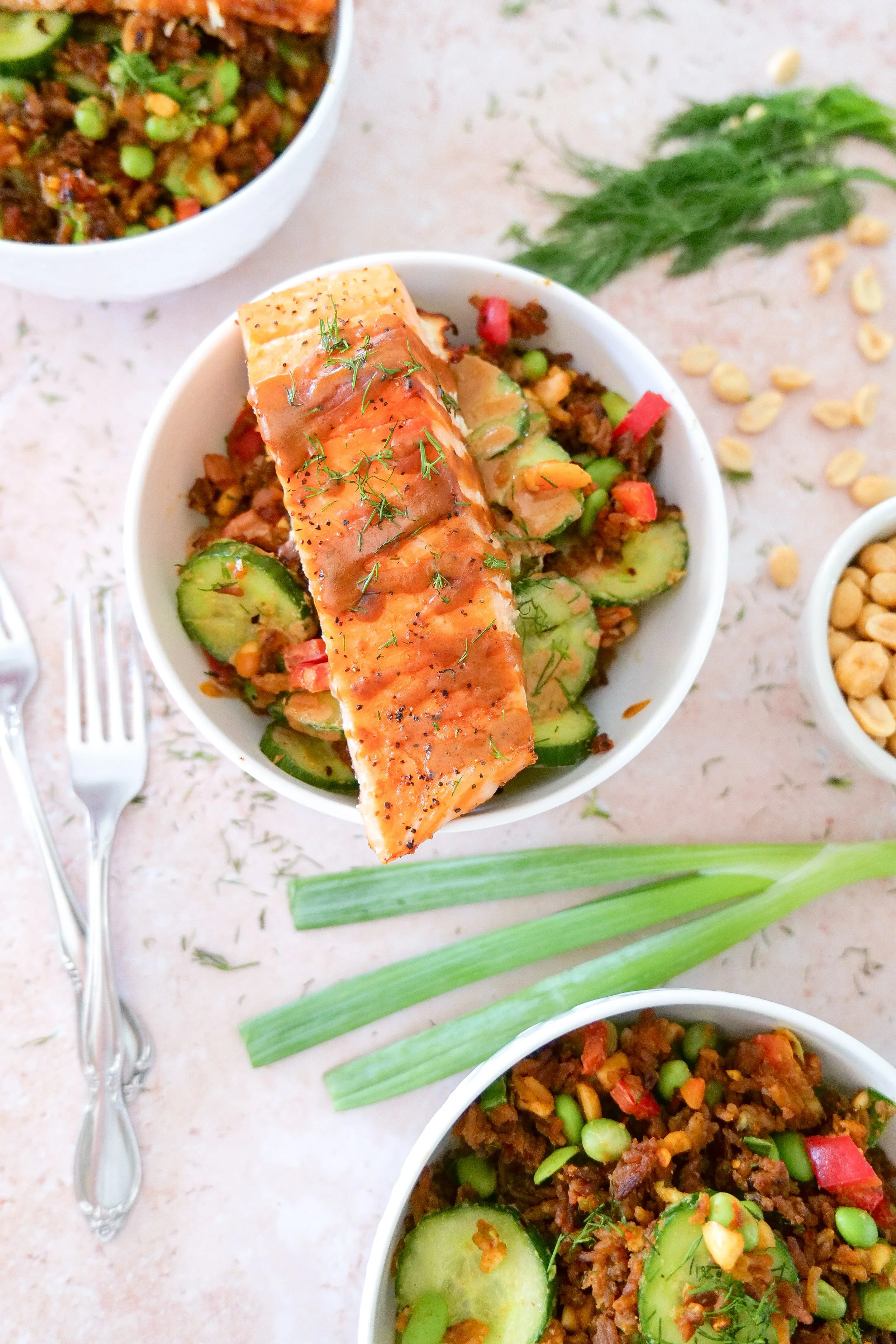 Crispy rice salmon salad with avocado, cucumber, edamame and peanut sauce.