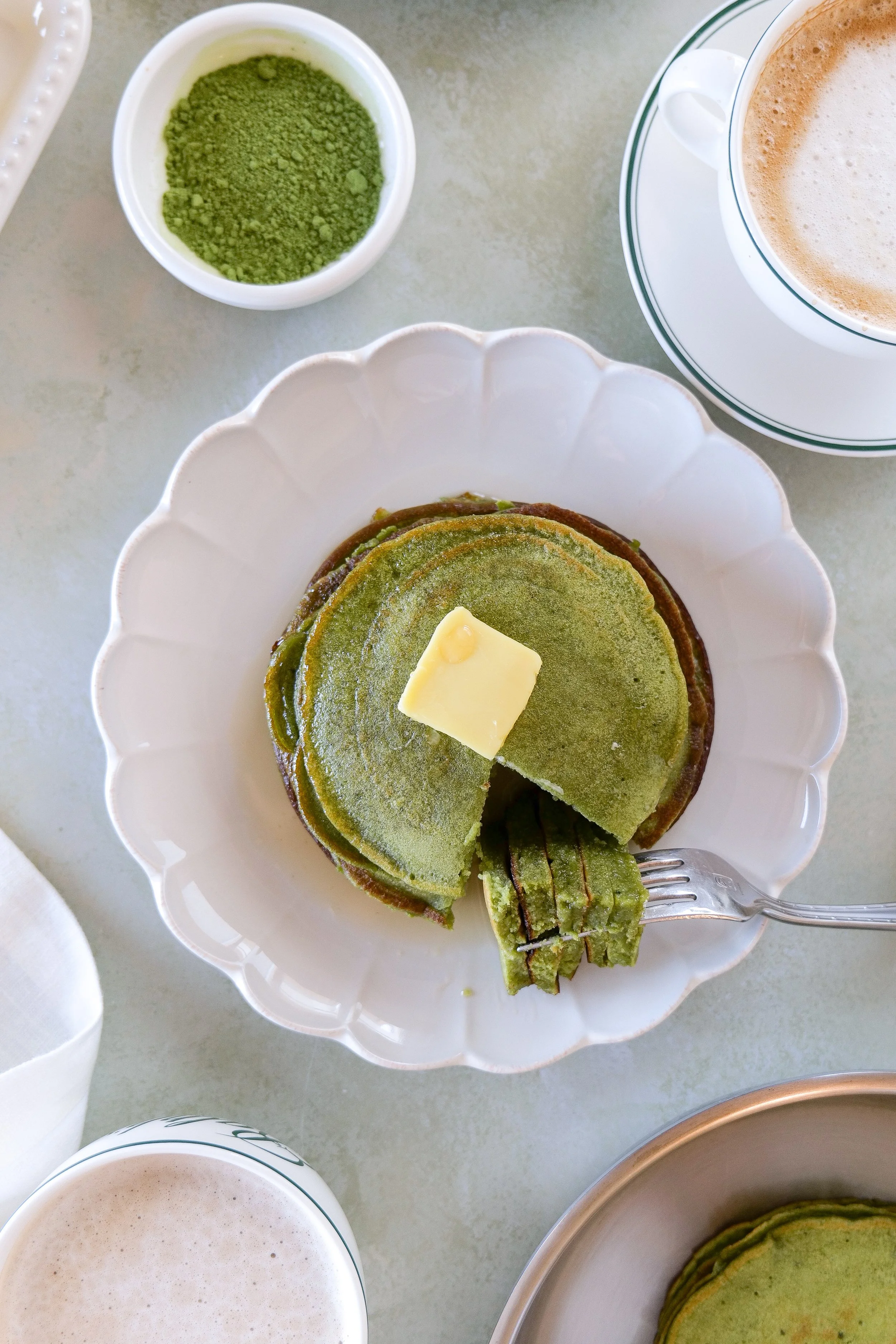 Breakfast plate with fluffy matcha sourdough discard pancakes and butter