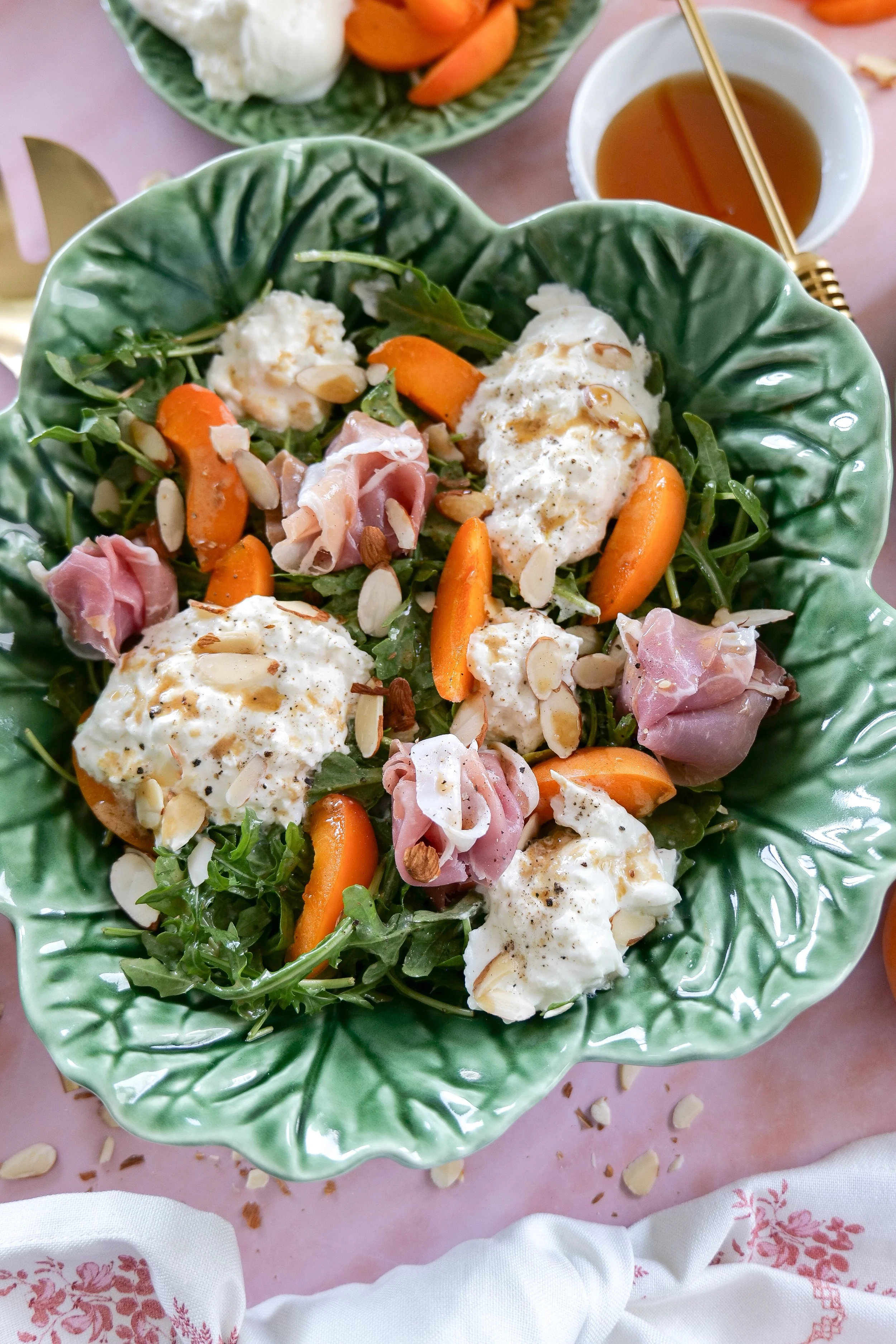 Apricot brunch salad with creamy burrata and honey dressing.