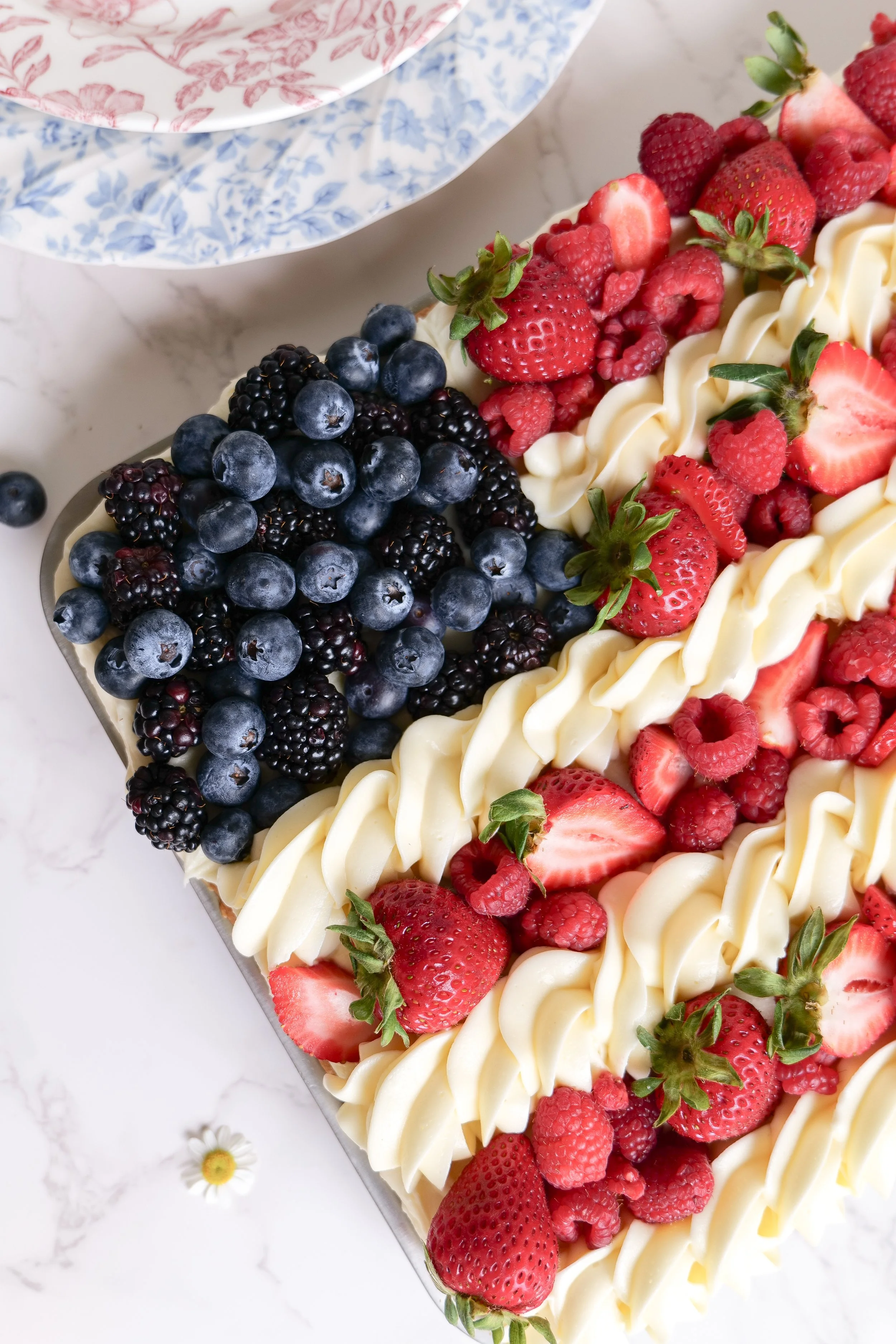 Easy patriotic dessert recipe with fruit and cream cheese frosting