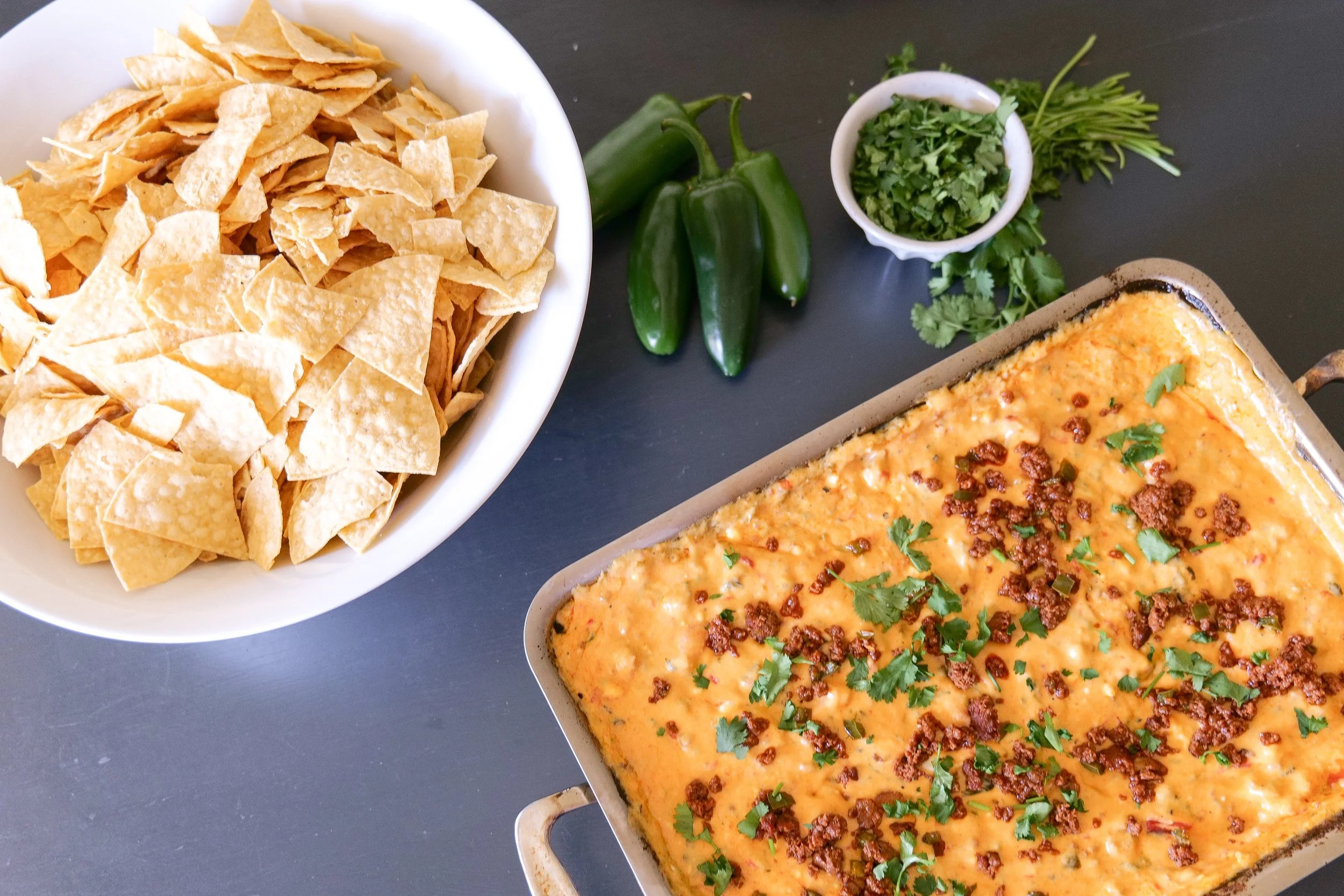 Creamy chorizo queso topped with jalapeños