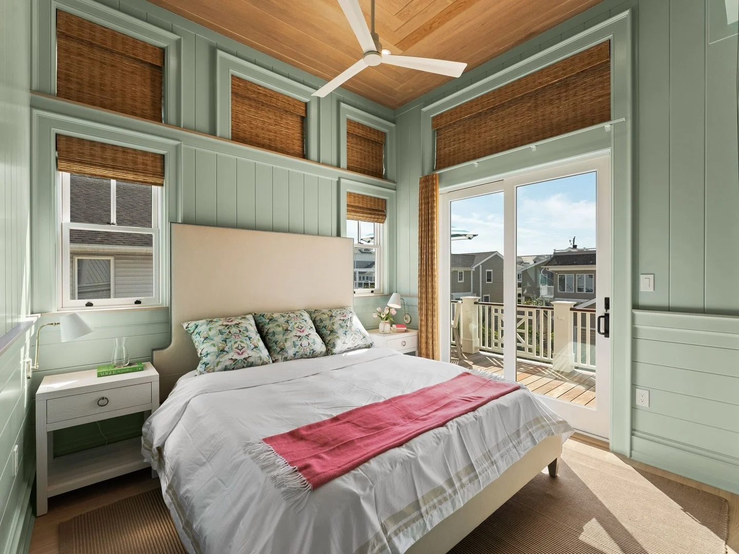 Soft coastal layers and natural textures make this bedroom feel like a breath of fresh air 🌊 The herringbone wood ceiling draws your eye up, while the soft blue paneling and woven shades bring warmth and a relaxed, beachy feel. Paired with crisp bed