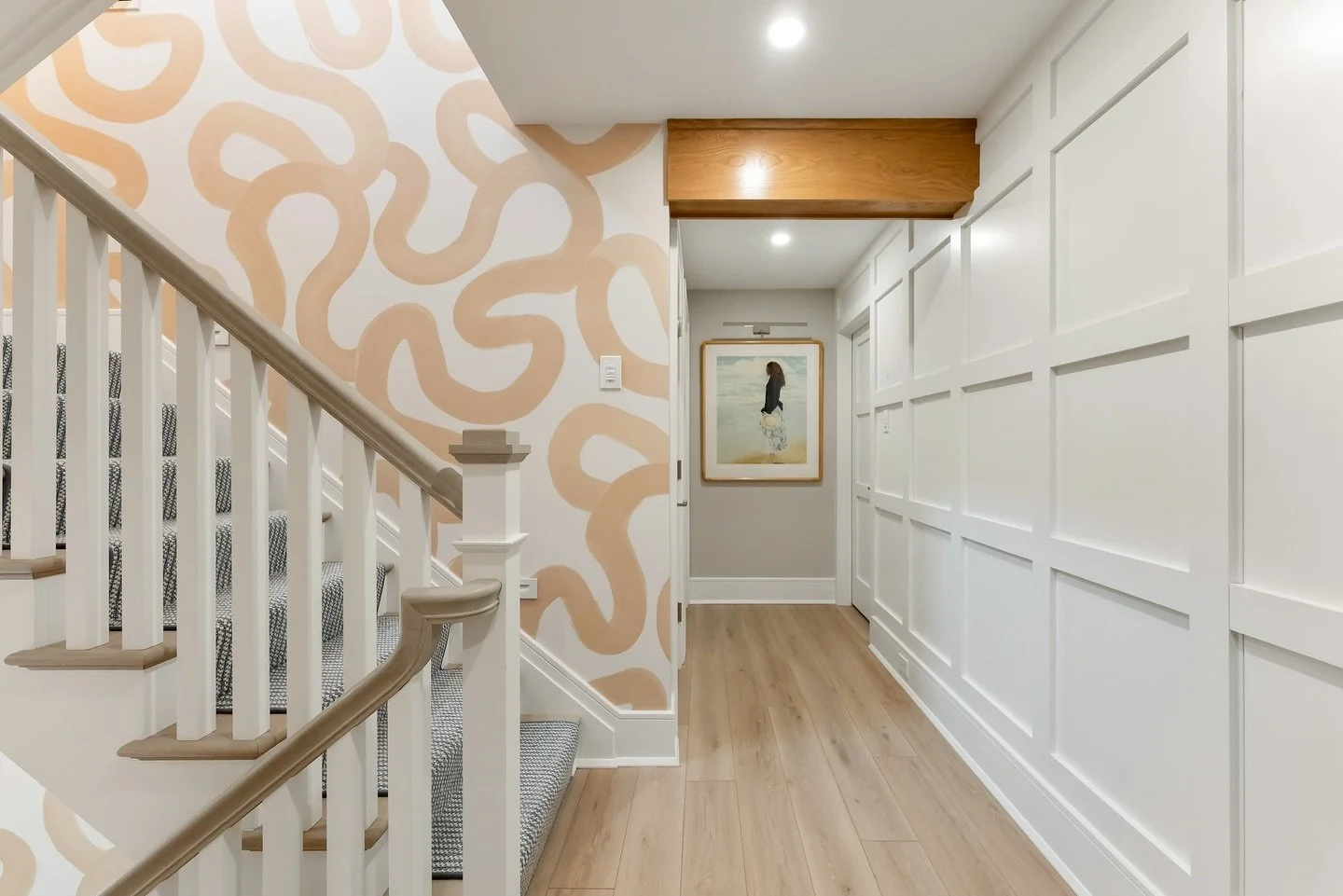 Proof that a staircases don't have to be boring 🤍✨This playful, oversized pattern brings movement, personality, and just the right amount of fun while still feeling soft and elevated in a neutral palette. Paired with classic paneling and warm wood t