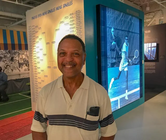 Charles Smith, NJ teaching pro and former ATA player, came by the VR Exhibition to share remembrances of watching Arthur in person in the 1968 US Open finals. He then located an image of his 1968-self in the large photo in the back, frame left!