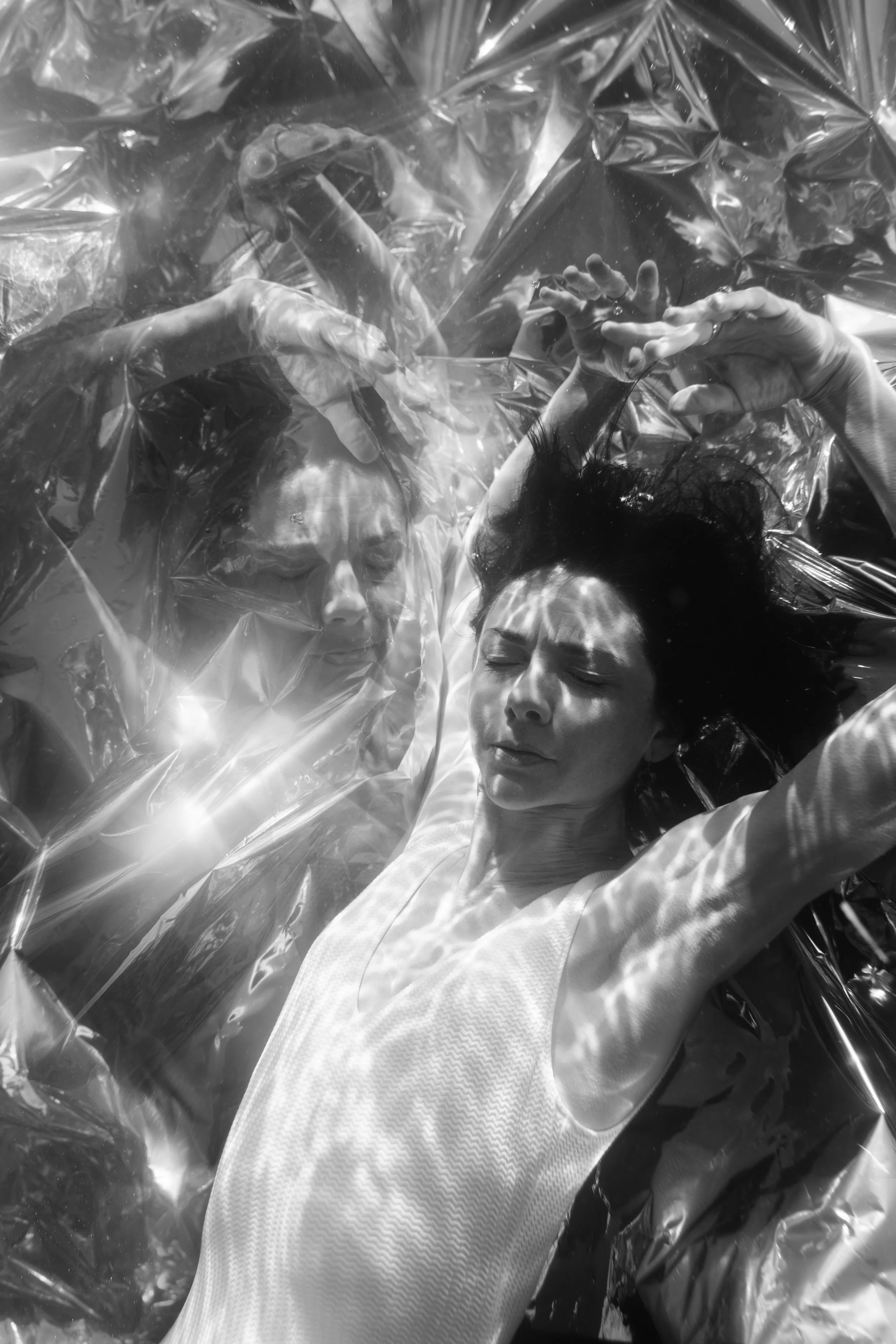 Abstract black and white portrait with reflected light and sculptural movement