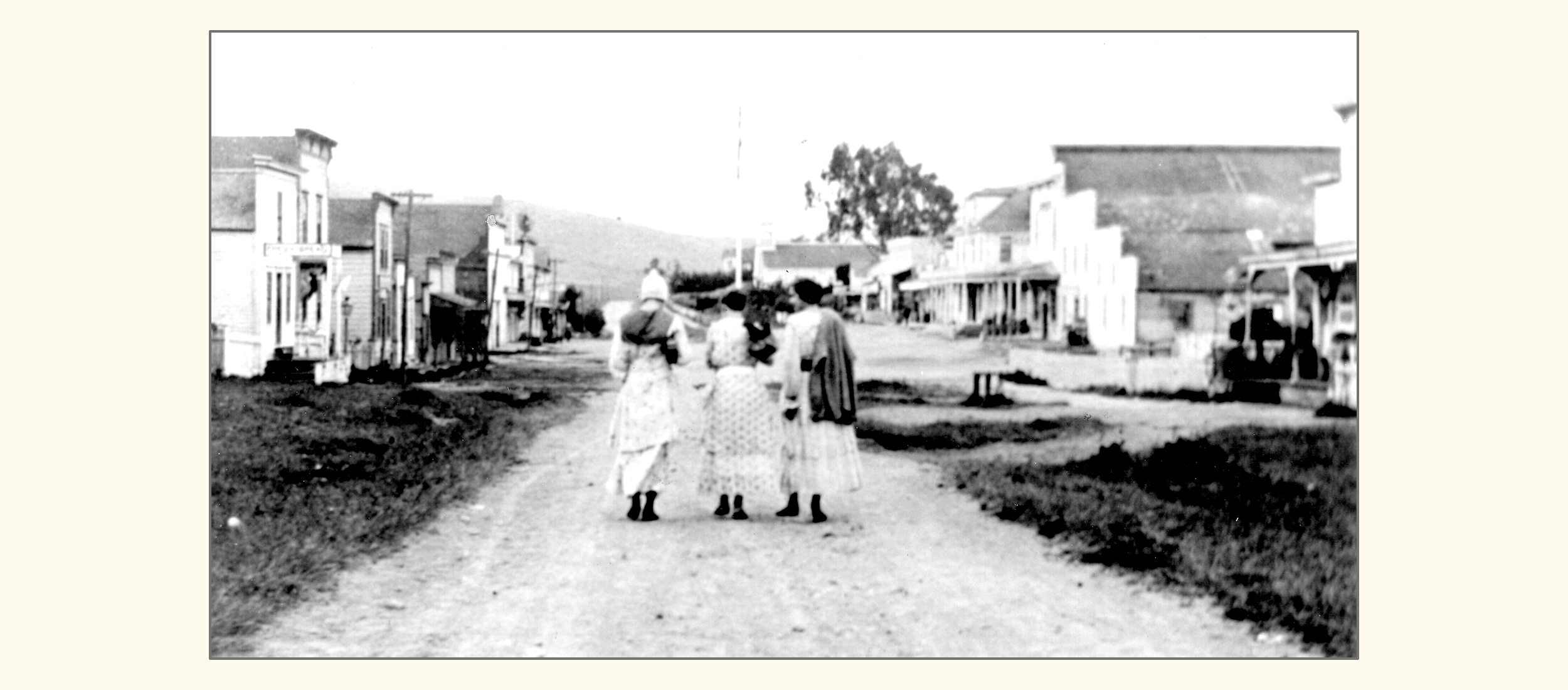 Three young women on Maine Street (Highway One), Tomales (1917)