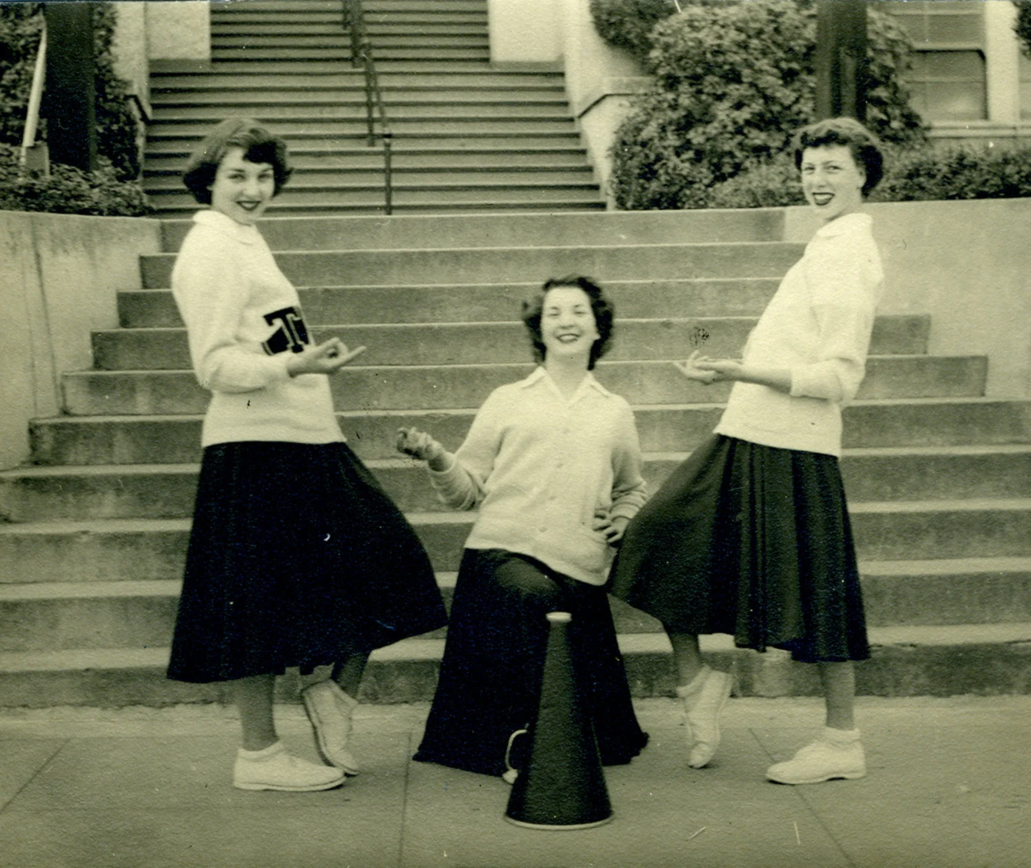 Tomales High School yell leaders (l‒r) Beverly Fiori, Louise Gonnella, and Lois Thompson, at the school’s front steps,1950.