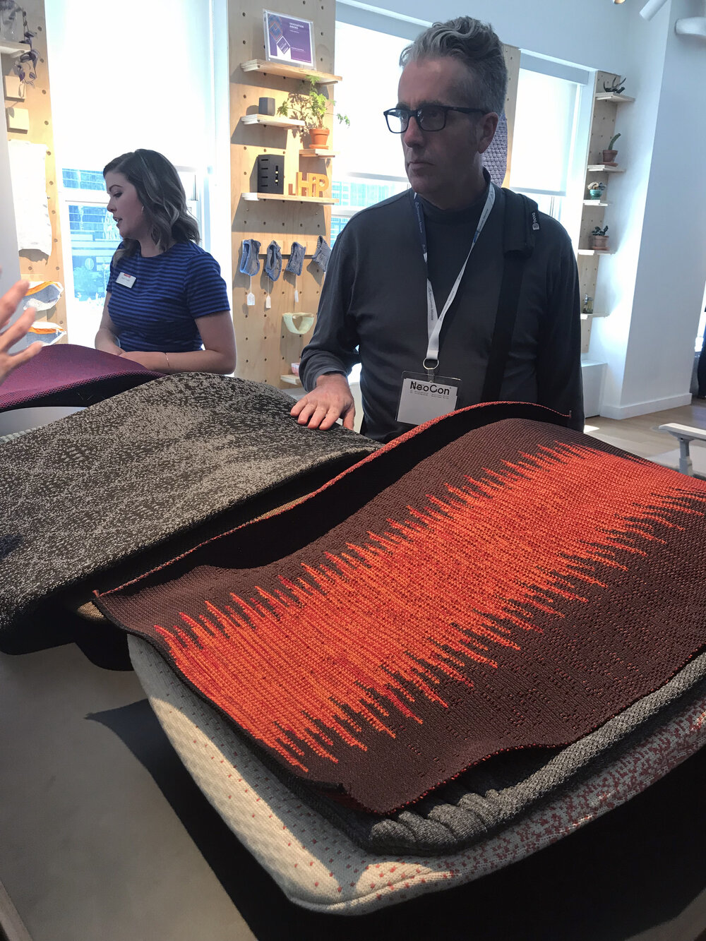  Formation Partner, Bob Henshaw evaluates  Haworth Digital Knit  office chair back samples while learning more about the technology. 