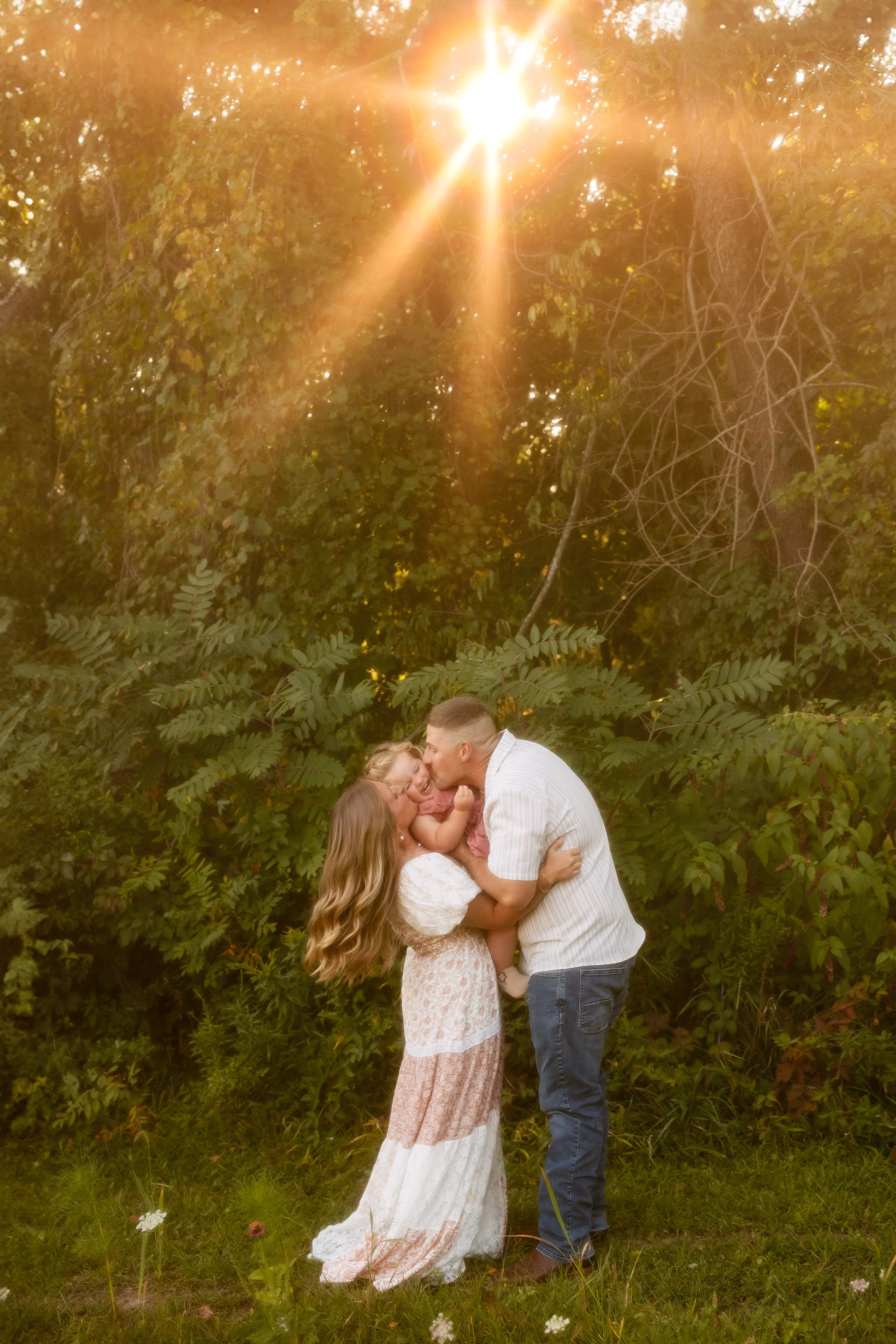 Family photo in front of greenery near Grand Rapids Michigan