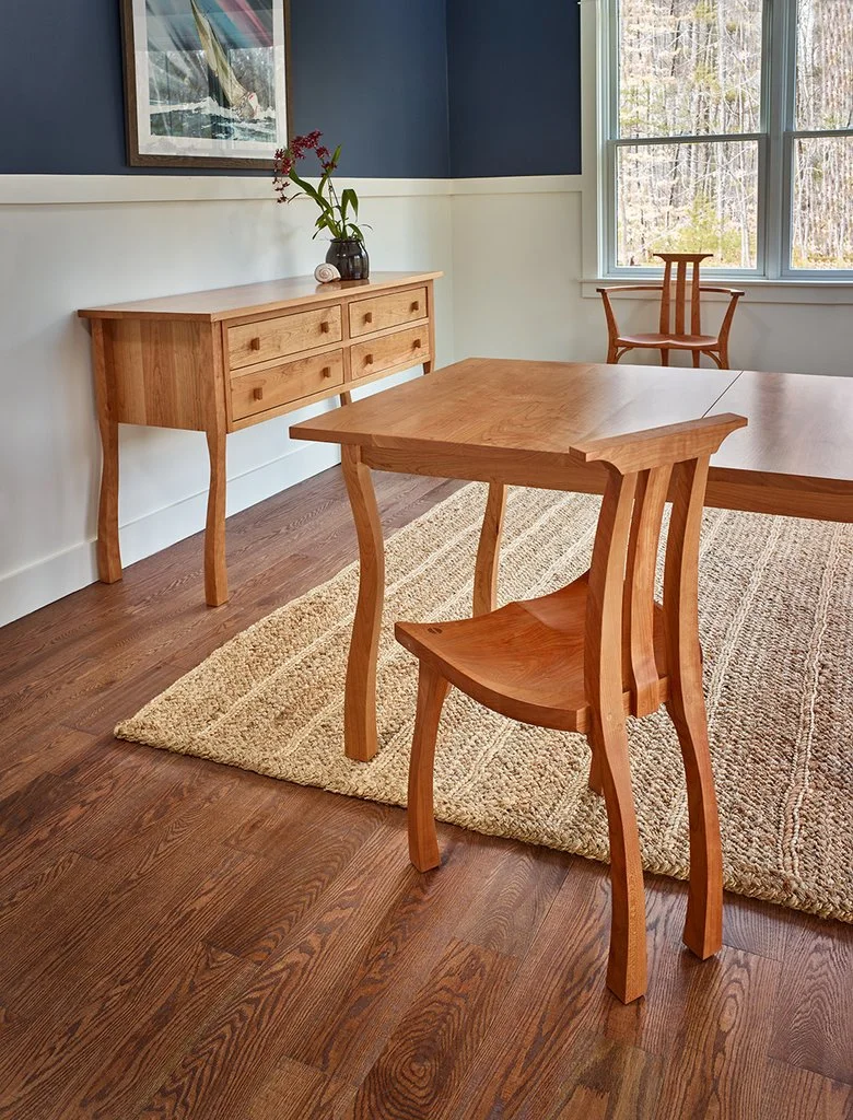 Designed by Peter Thompson, this line of dining furniture features cherry, some of which is grown in Maine.