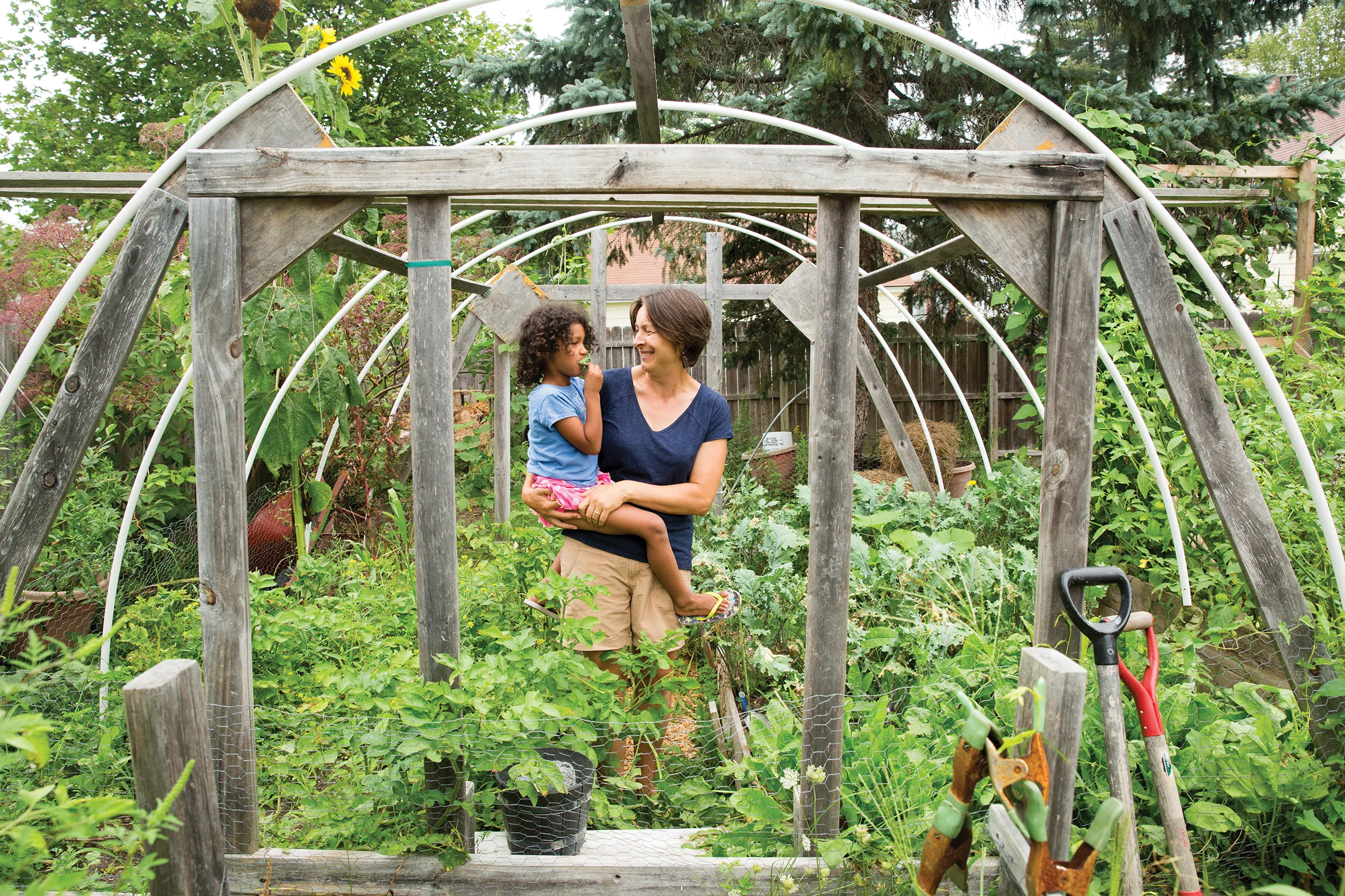 Karen Wilson constructed her hoop house from futon scrap wood to extend the season for growing favorite greens such as kale and sorrel. Photo: John Finch
