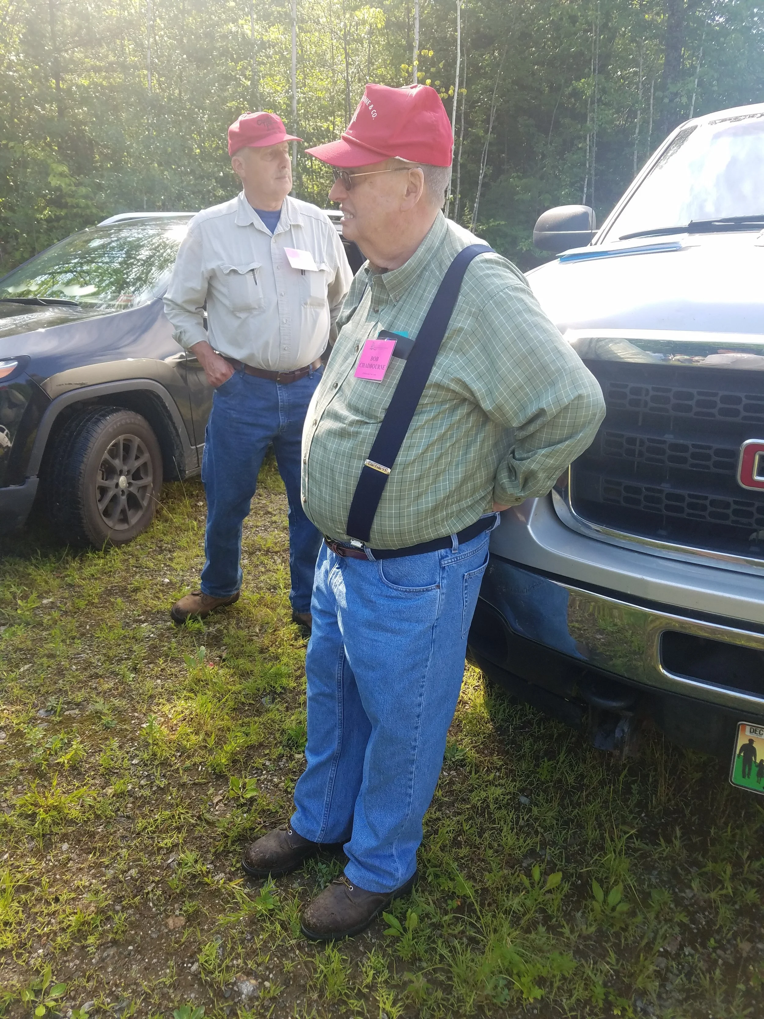Bob Chadbourne hosts a recent delegation of foresters who came to admire his very large pine trees. Photo: Brian Roth.