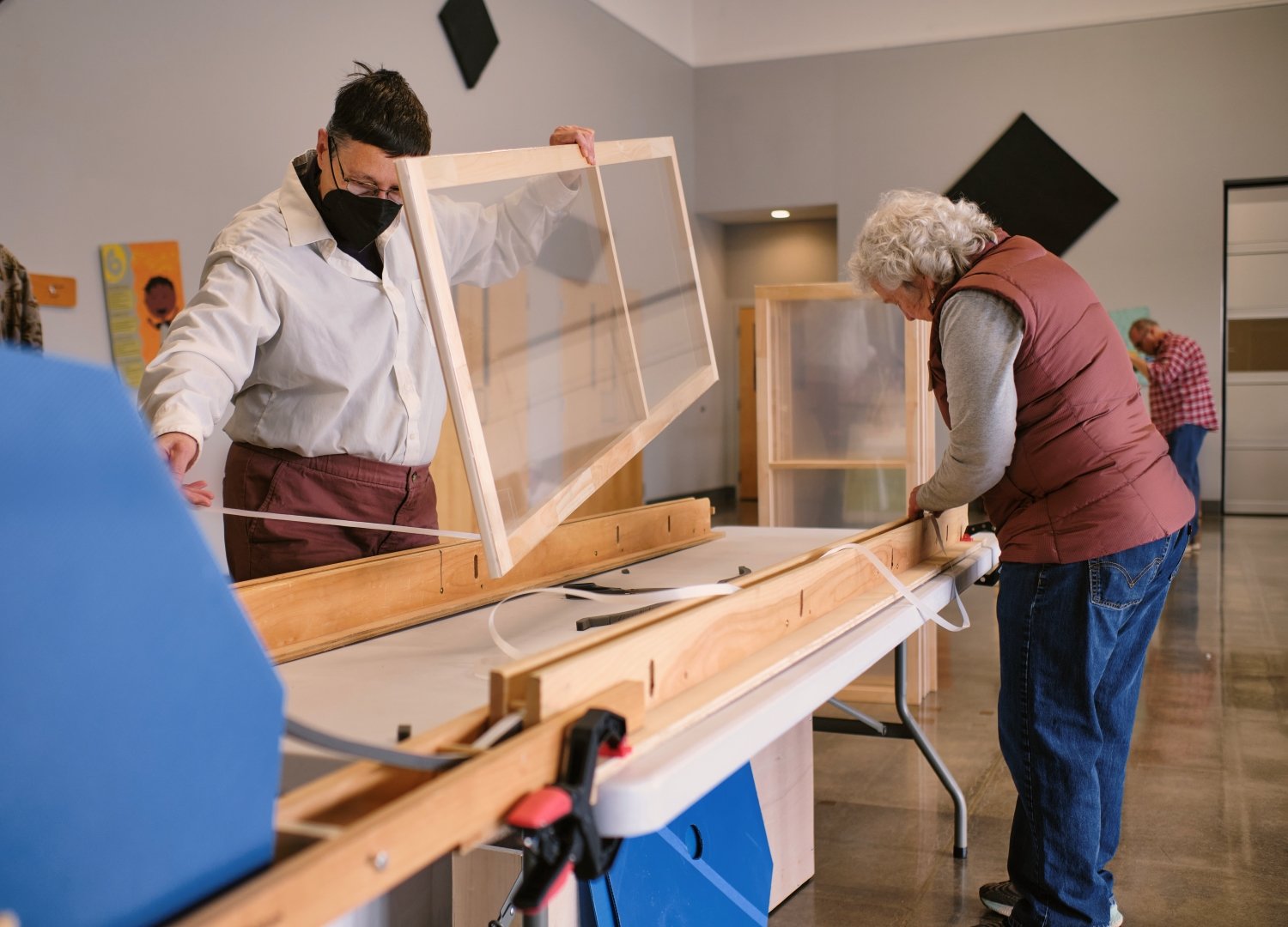 WindowDressers volunteers put together window inserts.