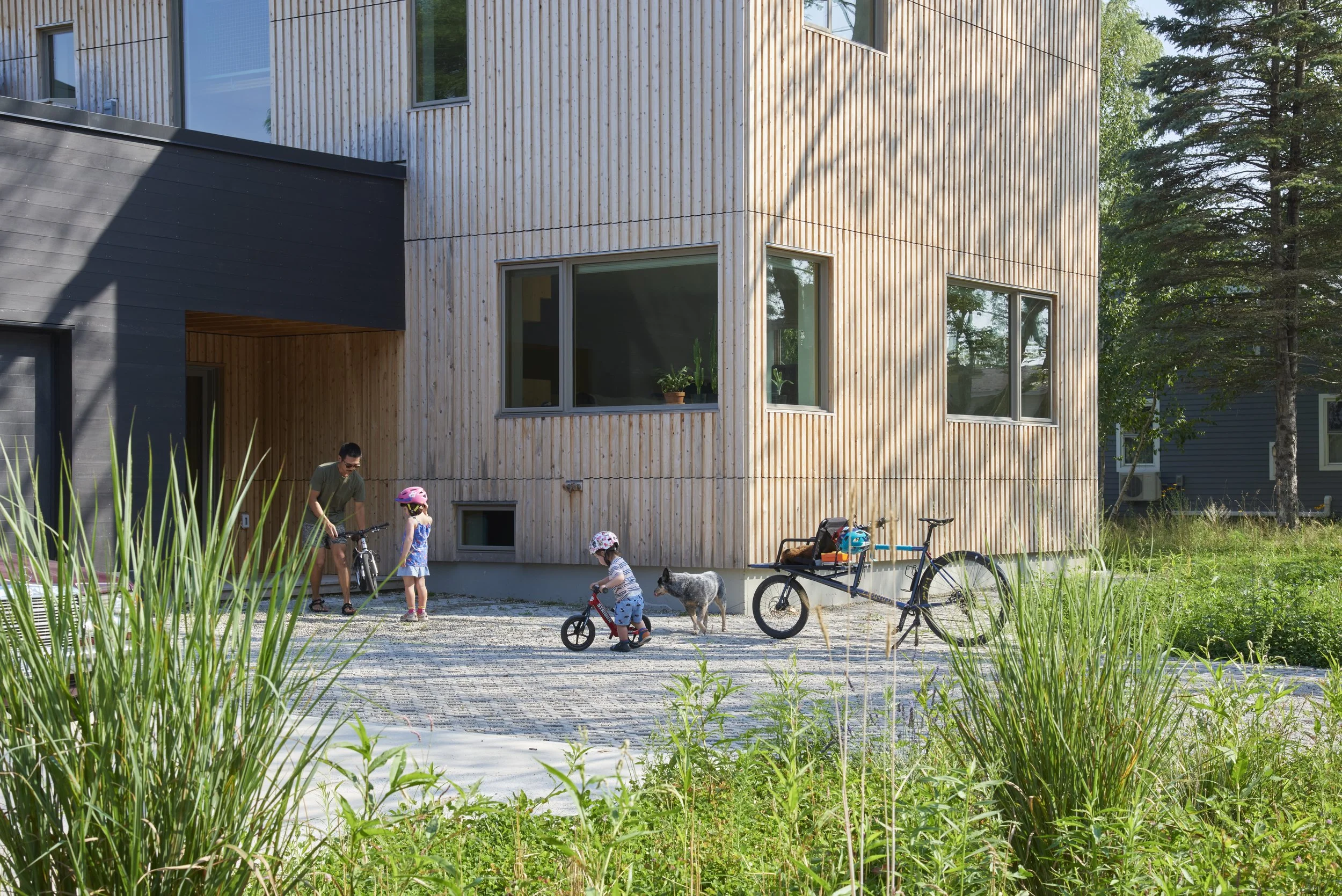 The exactingly assembled Northern white cedar siding from Maine Cedar Store in Portage was installed piece by piece over a period of two months; the raw wood will naturally weather to a gentle gray over time.