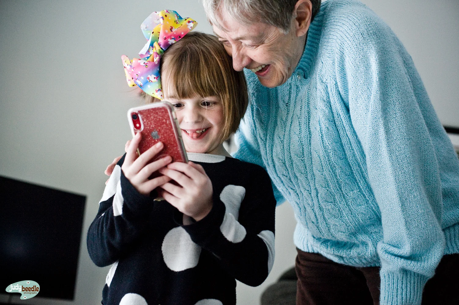 3/1 The niece {Button} and my mom {Jamma} being entertained by animojis.