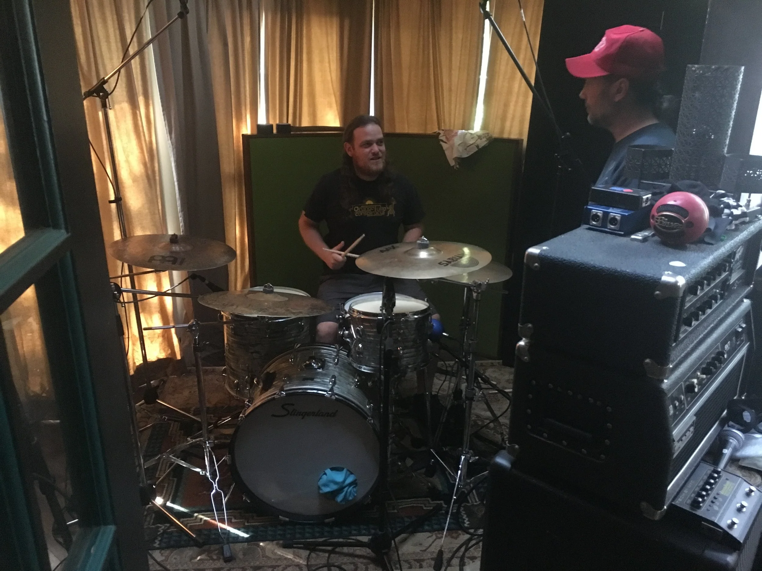 Paul Wagner and Aaron Hill setting up to record drums for “Snakes.”