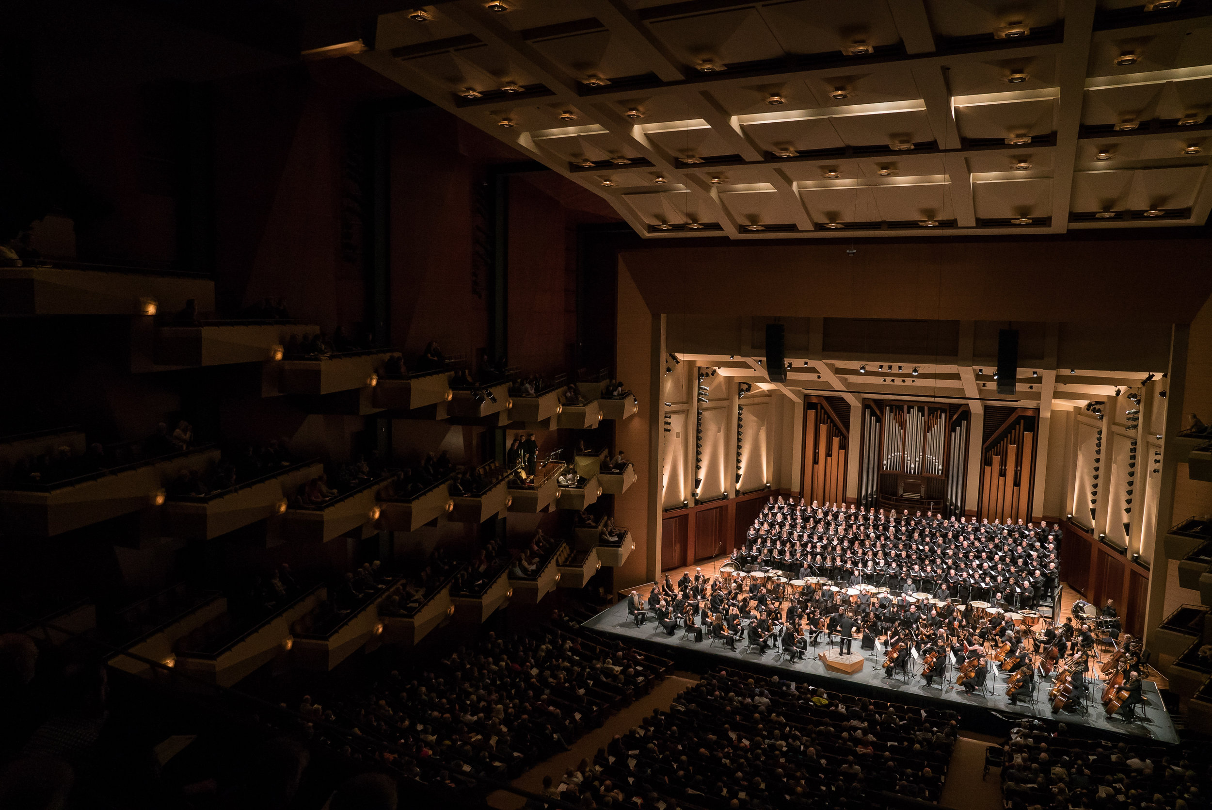 Ludovic Morlot leads the Seattle Symphony in a performance of Berlioz’s Requiem at Benaroya Hall in November 2017. Brass choirs were positioned aloft at each corner of the hall to generate the directional "surround-sound" that Berlioz intended. Phot…