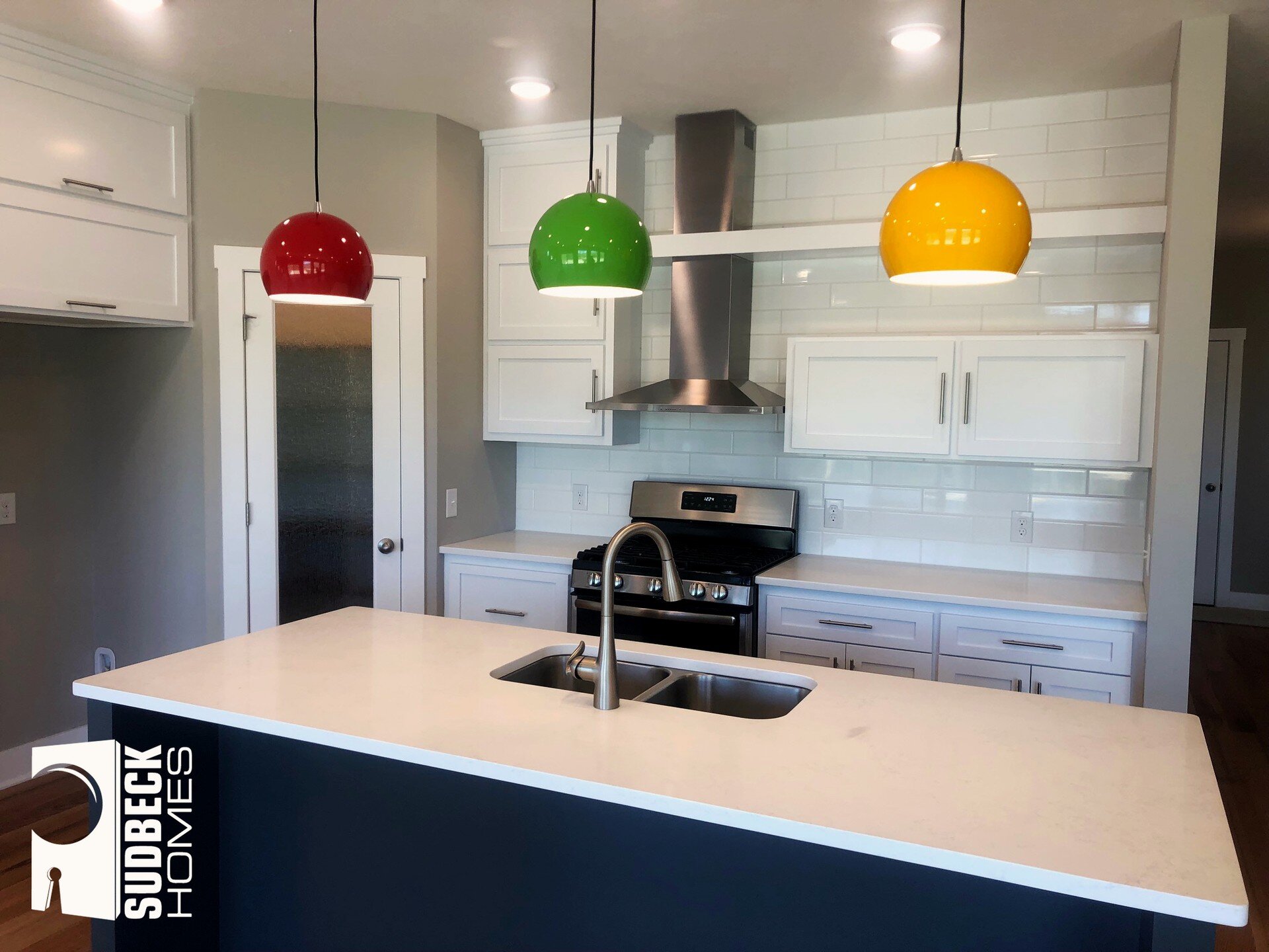 Another day, another fun kitchen! Great countertops with tons of space, along with the cabinets. The custom styling and placement of them throughout the kitchen give it a special look. Finally, we cannot forget to talk about those M&amp;M lights! SO 