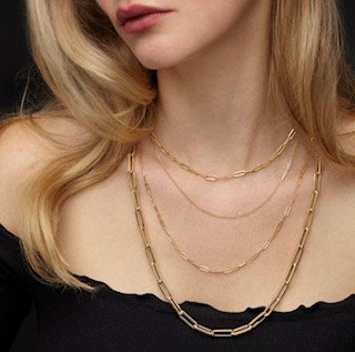 model wearing paperclip chain necklaces layered