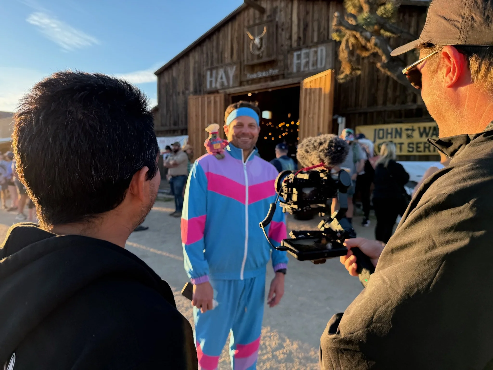 The runner and his...trainer standing for interviews before the John Wayne Half Marathon!