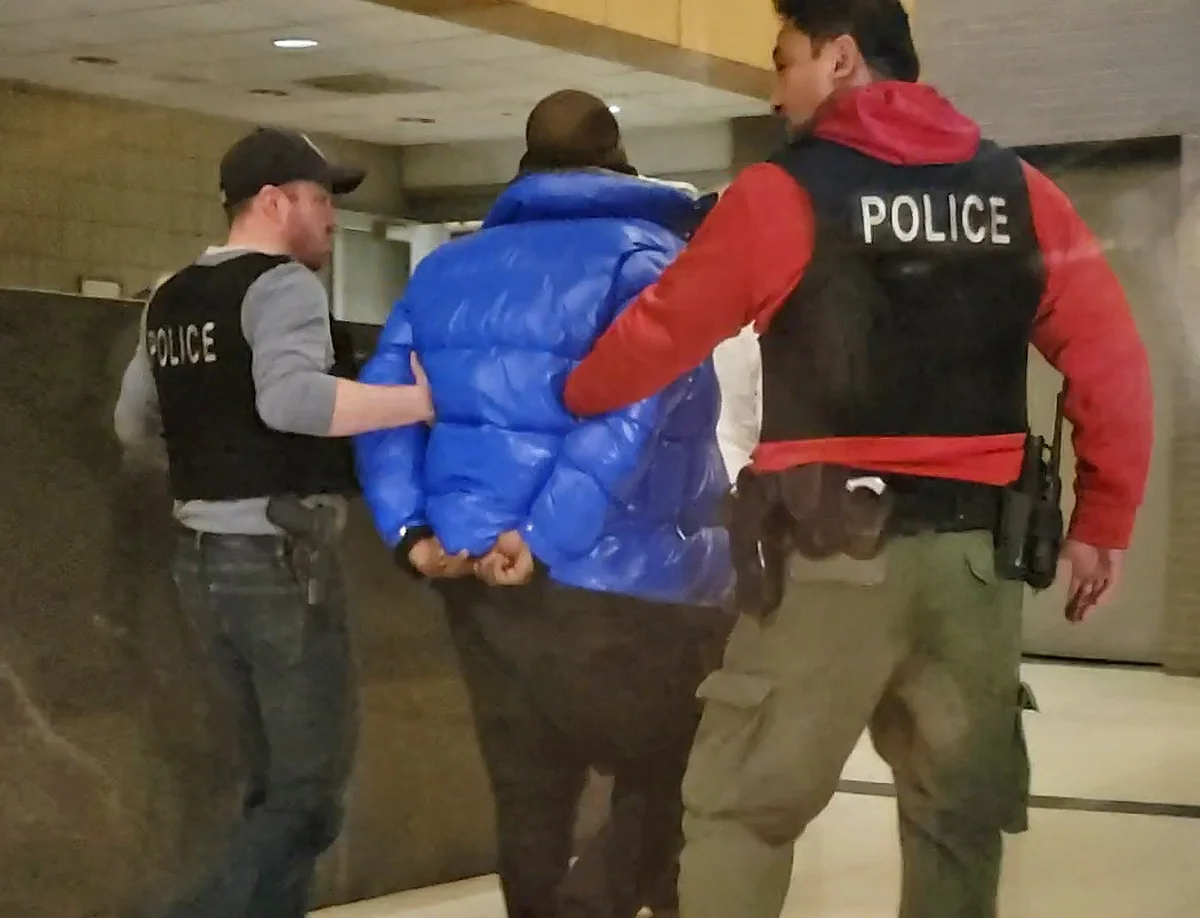 R. Kelly seen in Police custody for sexual misconduct against a minor from 1999 and 2000
