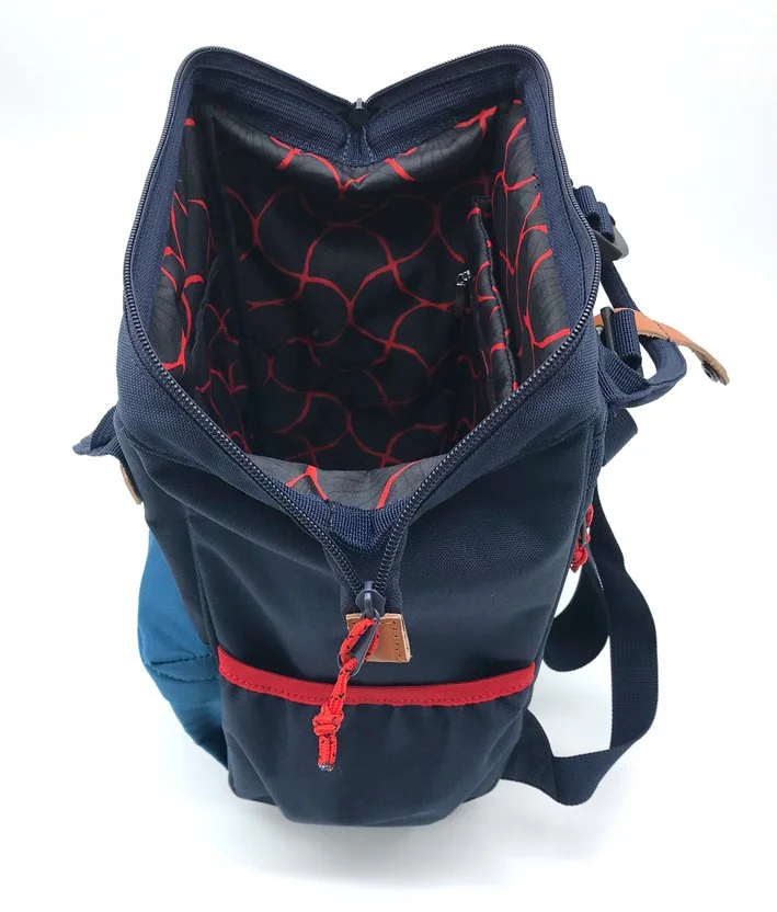  12L backpack large zipped opening showing the full printed 150D lining.   Made for  Nature &amp; Decouvertes © 