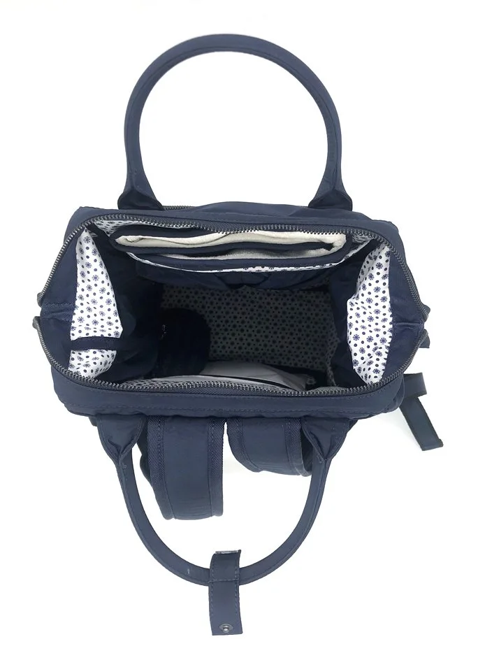  Two ways carry nursery backpack with organized pockets.  Made with Nylon and full printed lining 