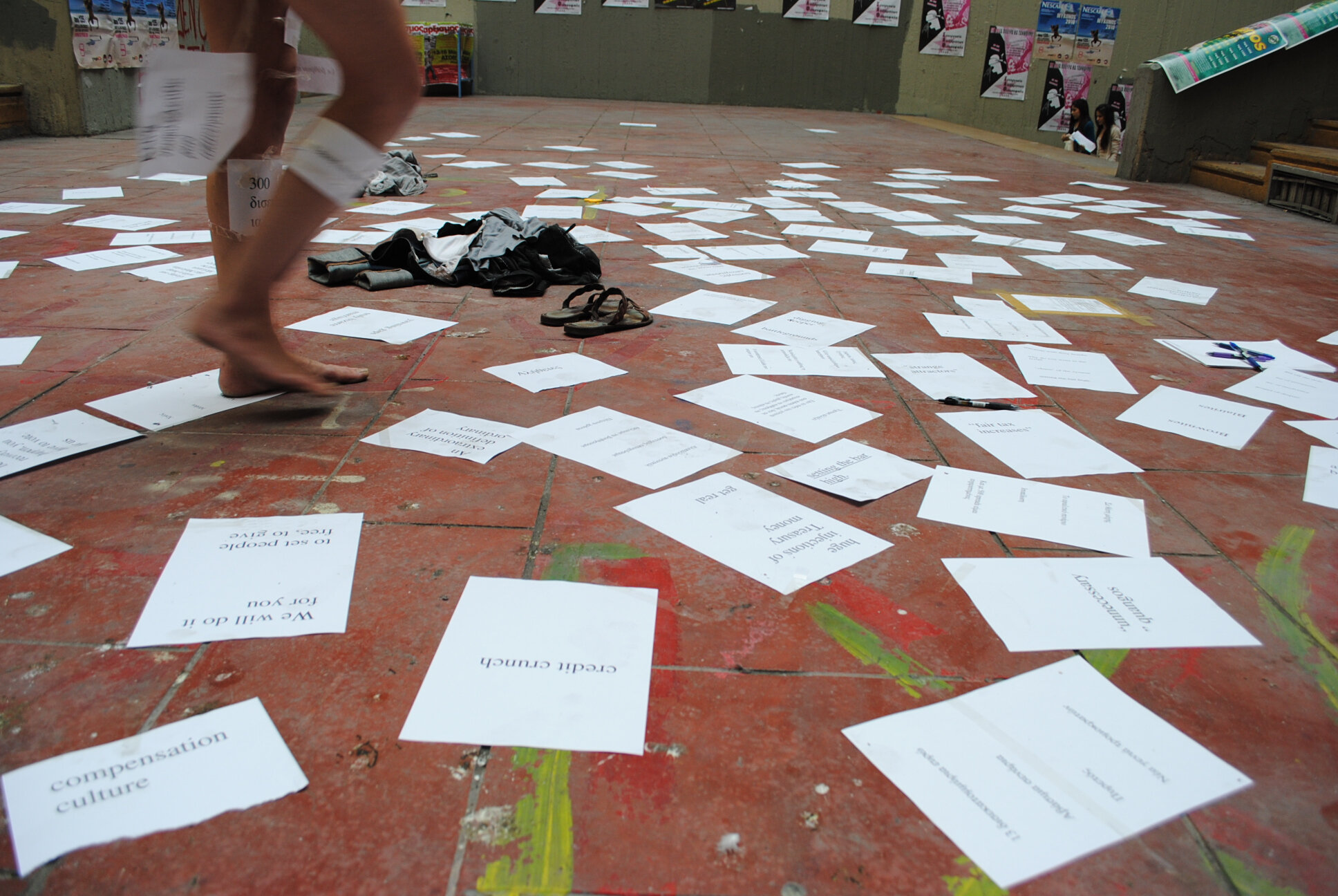 Promote only acts of poetical t_papers on floor.jpg
