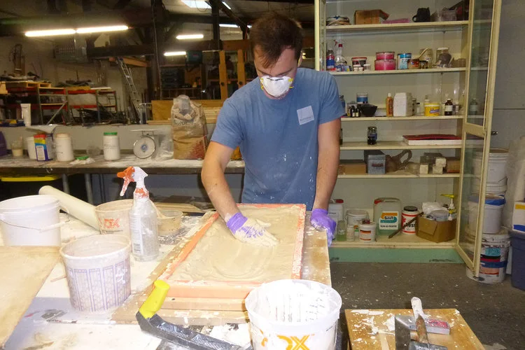 materials-conservation-linode-tile_0000_03+Dan+filling+in+cast+for+new+tile.jpg