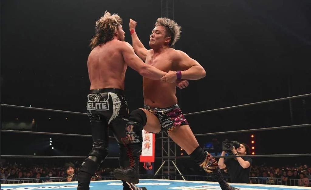 Charged Shot Slam-Long: Kenny Omega Vs. Kazuchika Okada III Charged Shot Slam-Long: Kenny Omega Vs. Kazuchika Okada III