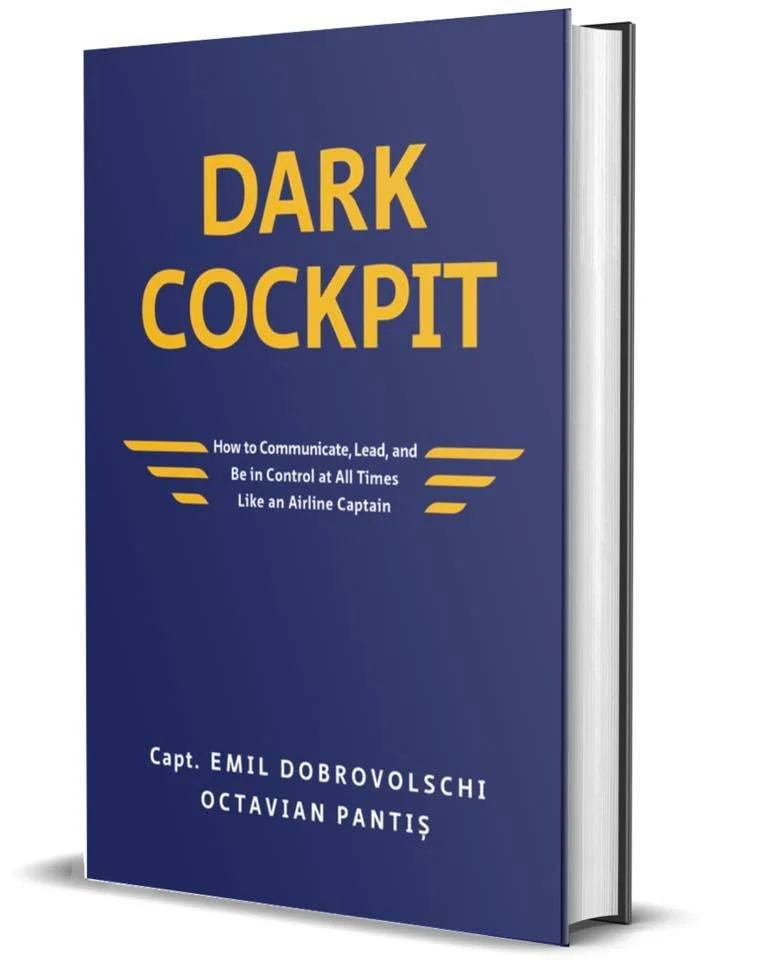 Navy-colored book jacket for the book Dark Cockpit with the title written in bold yellow lettering.