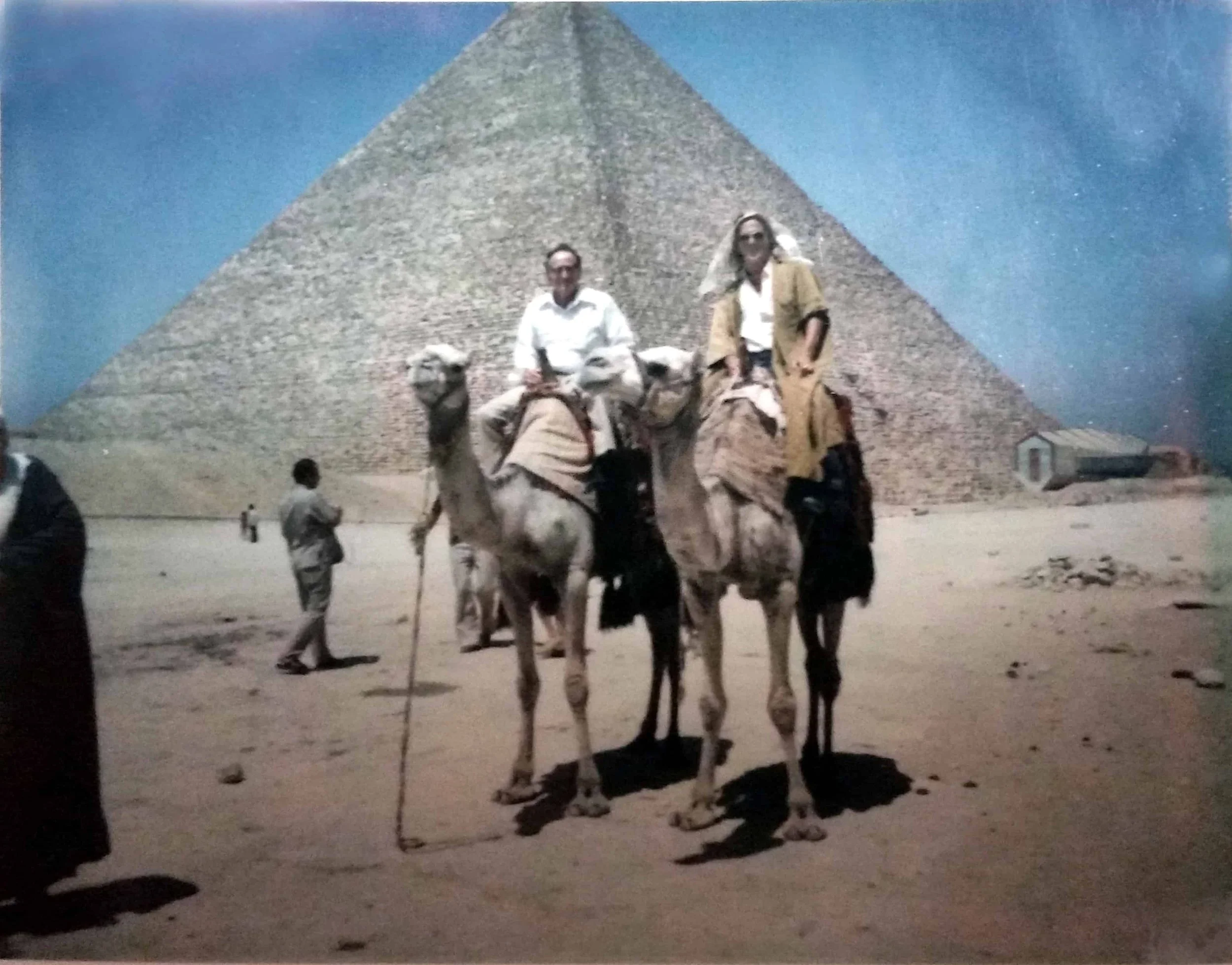 Father and son ride camels at the Great Pyramids in 1975.eat