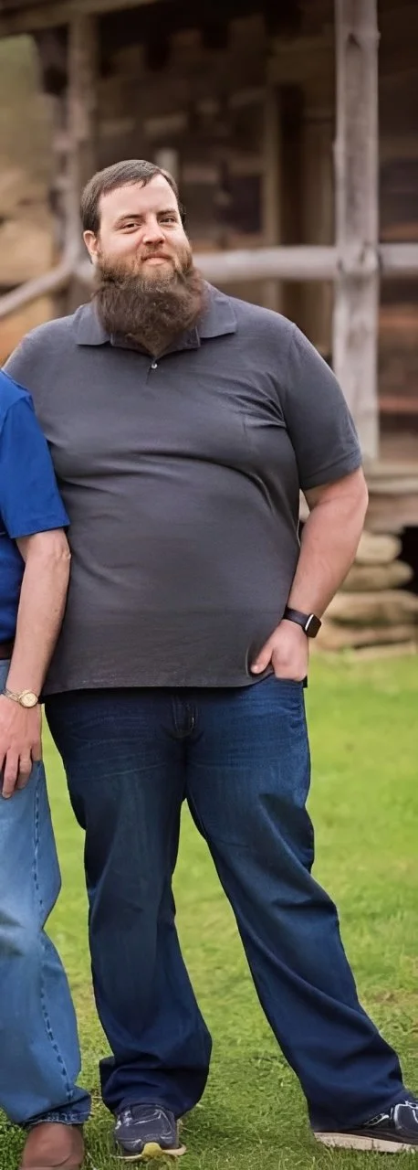Man standing outdoors before losing 130 pounds.
