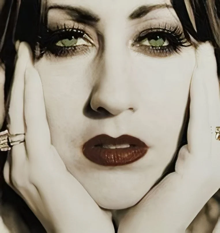 Close up of a woman's face on an album cover.