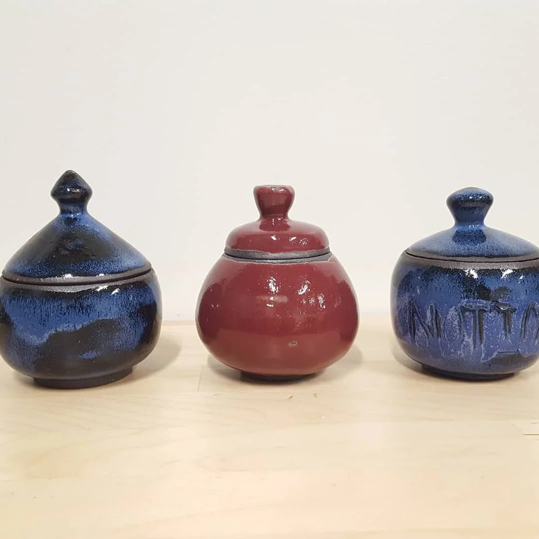 Tiny jars! 
I decided to venture down the jar rabbit hole in June with some pretty neat results.  These jars were thrown as a bubble on the wheel, with the lids cut off after they were leather hard. They're all fairly small, under 3&quot; tall except