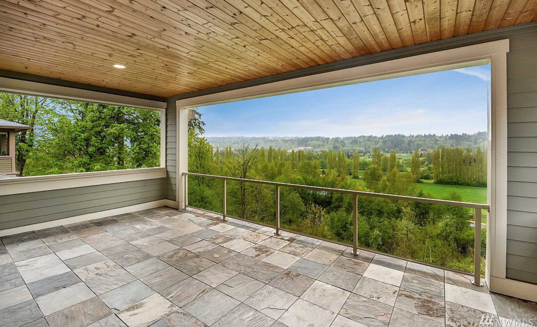 One of three private terraces, all adorned with warm-woodsy modern PNW design and outdoor lighting!