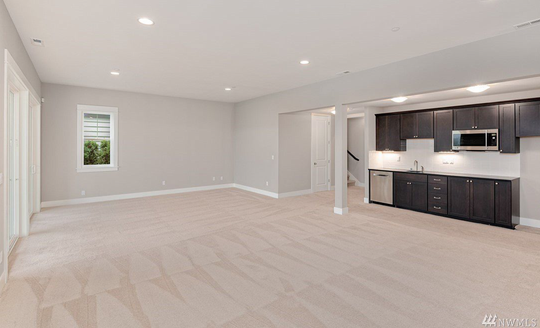 Huge finished 12' ceiling lower level with 2nd kitchen, 2nd formal master and beautiful play space, theater room or View master retreat, with private terrace!
