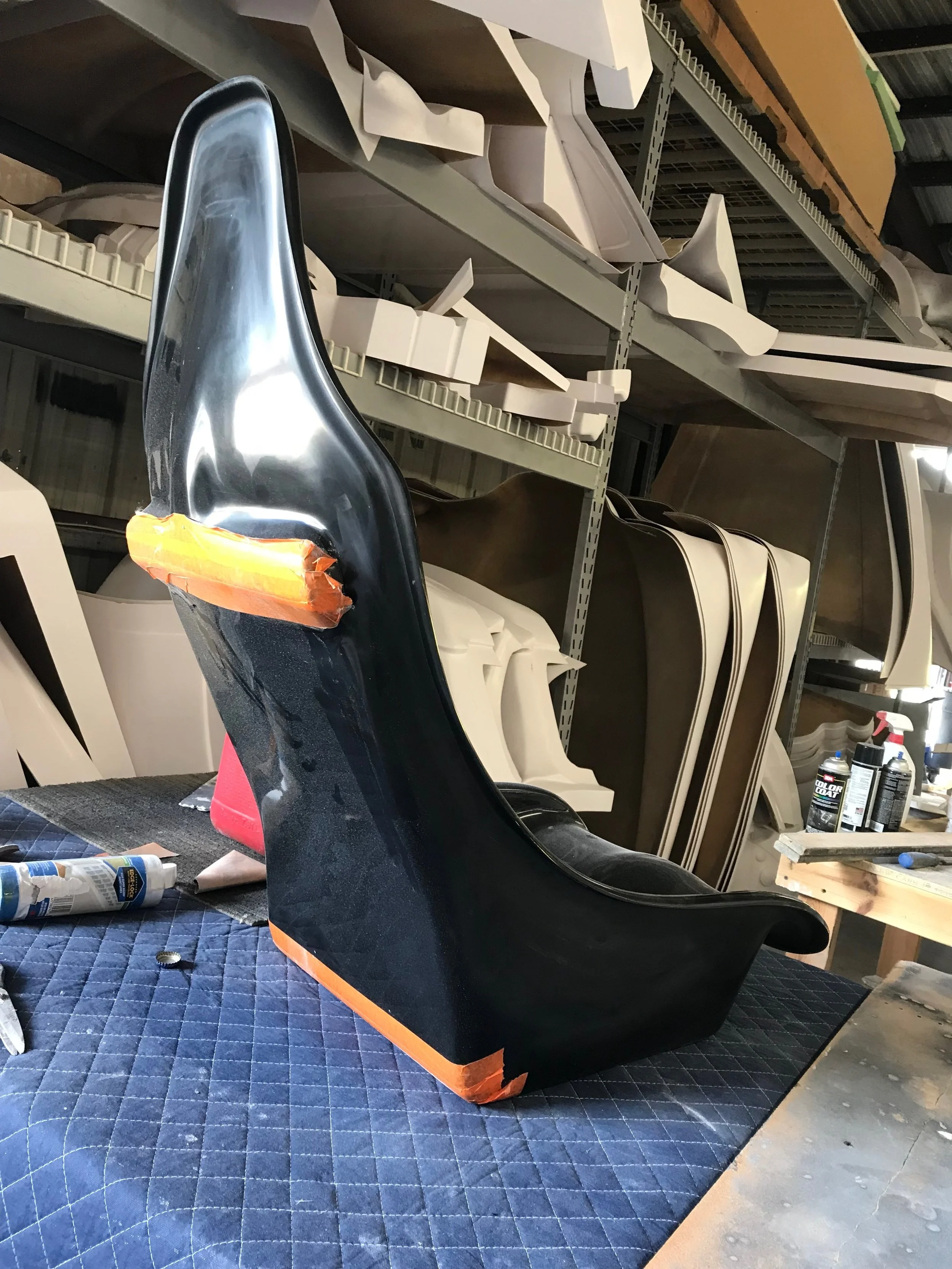  A digital model of the custom racing seat was created based on a scan of the interior of the frame. The full size seat was then cut from foam on the CNC machine and built out of fiberglass as a 2-part shell 