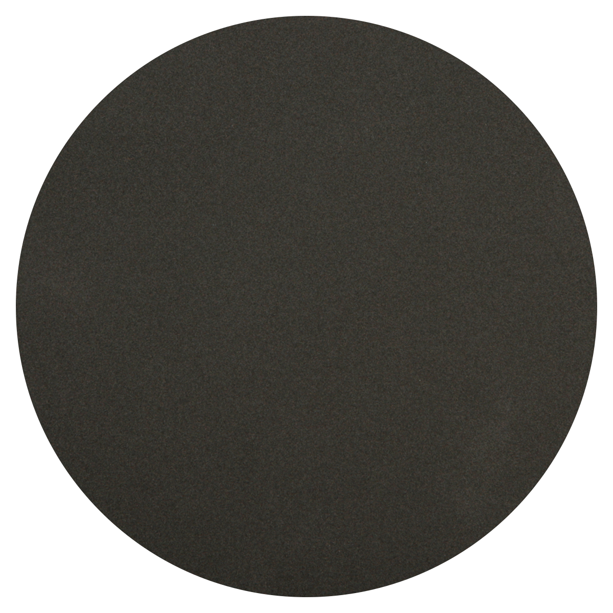 A close-up of a round, flat, black pepper grinder with a textured surface.