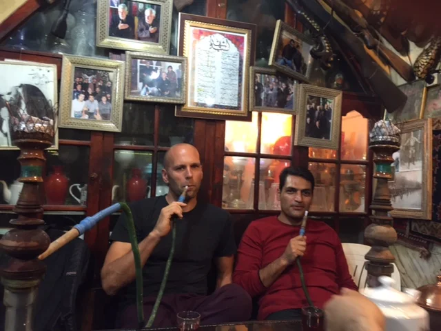 American and Iranian are smoking hookah
