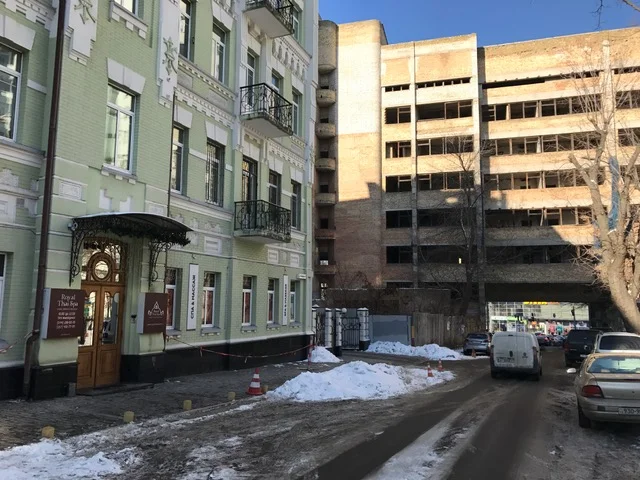 Thai studio on the left, decrepit building on the right