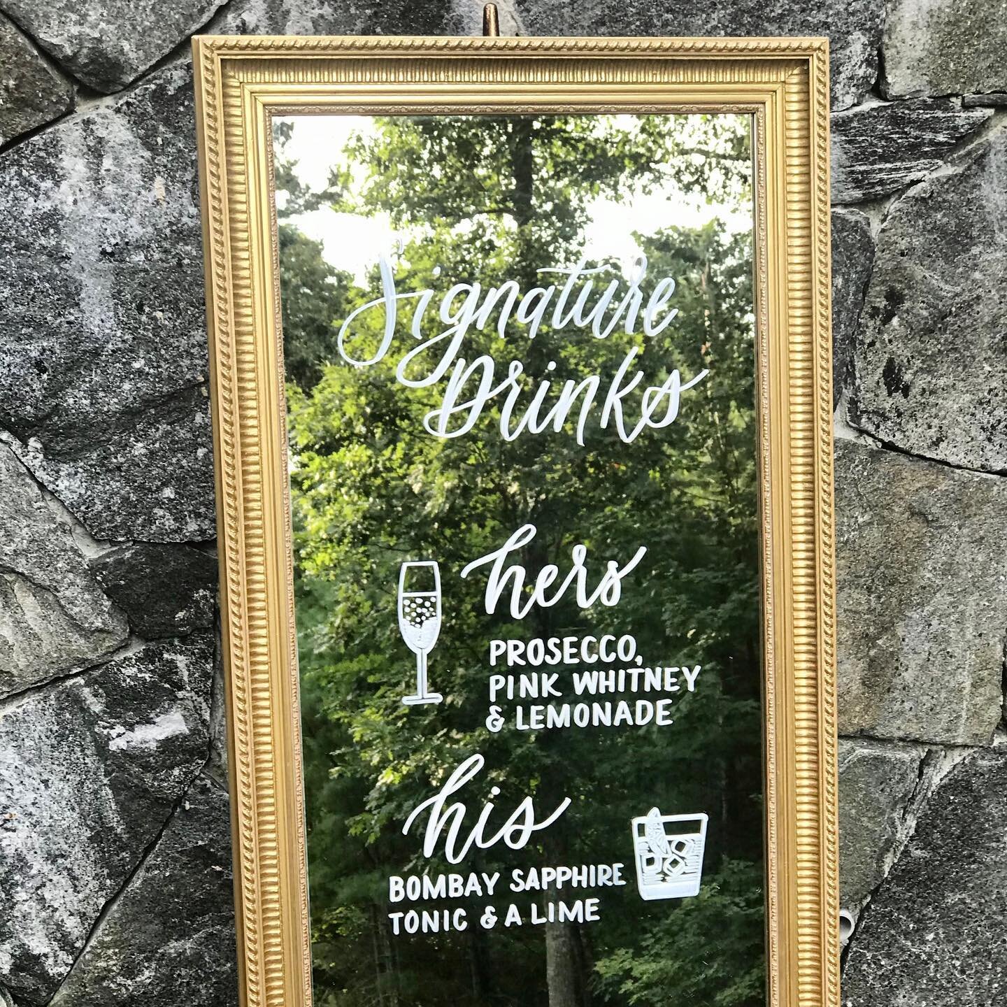 A signature drink sign next to the bar is always a good idea ✨
.
.
🪞 Gold Framed Mirror from my Rental Collection 
.
.
.
#weddingsignage #weddingsign #mawedding #northshorema #handmadesigns #bostonweddings #bostonweddingvendor #handlettered #modernc