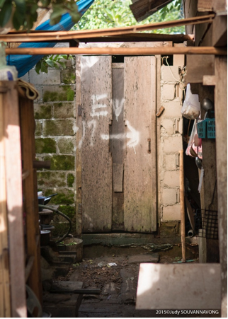 Noy’s family latrine was built in early 2014. Neighbors followed suit in their own construction of latrines, significantly raising sanitation standards in the surrounding community. Photograph by Judy Souvannavong.