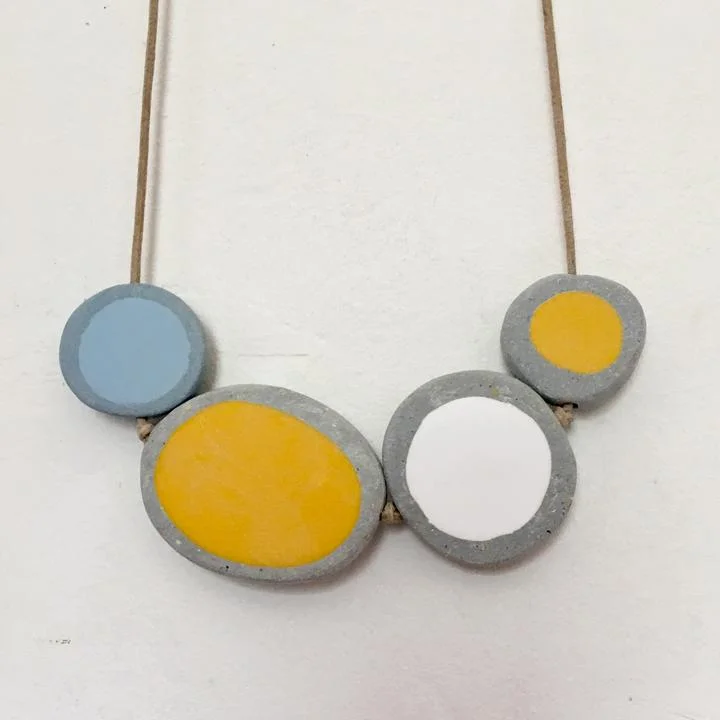 Bronwen Gwillam’s pebble-like jewellery is made from reclaimed plasticElegant, wooden, scandi-influenced kitchen accessories by Brüün Design