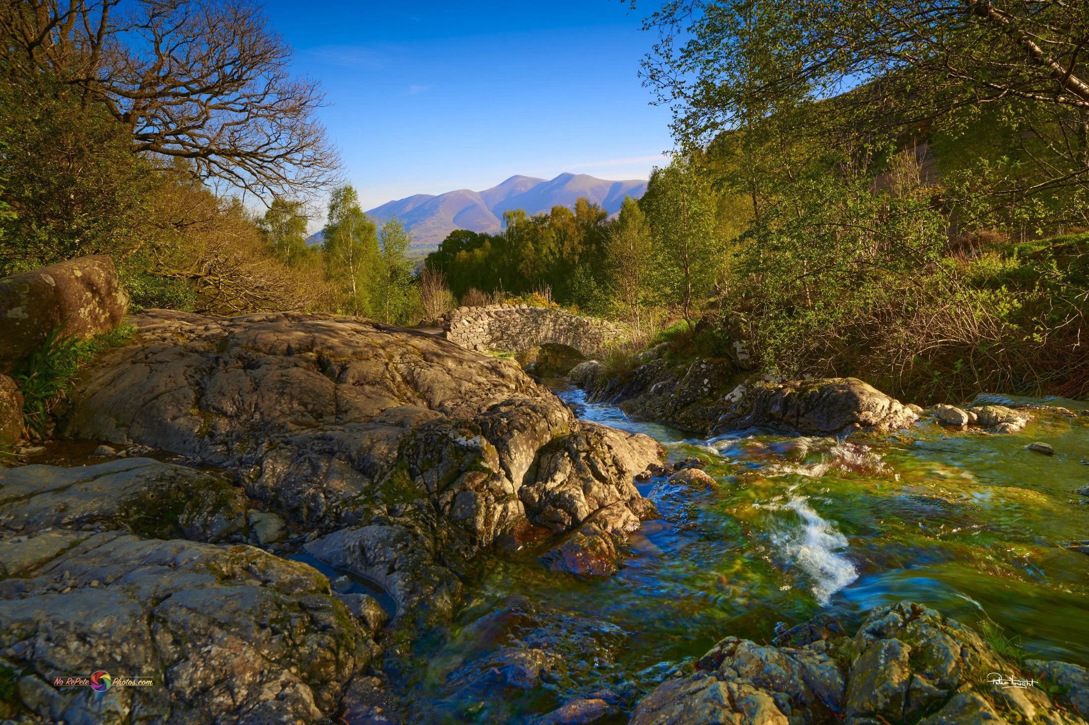  Follow The Stream  
 
 Ashness Bridge, Cumbria  
 
 Morning sunrise in mid spring that provides some greenery colour to the scene. 
 
   Nikon D850 Lens Nikon 16-35 F4  