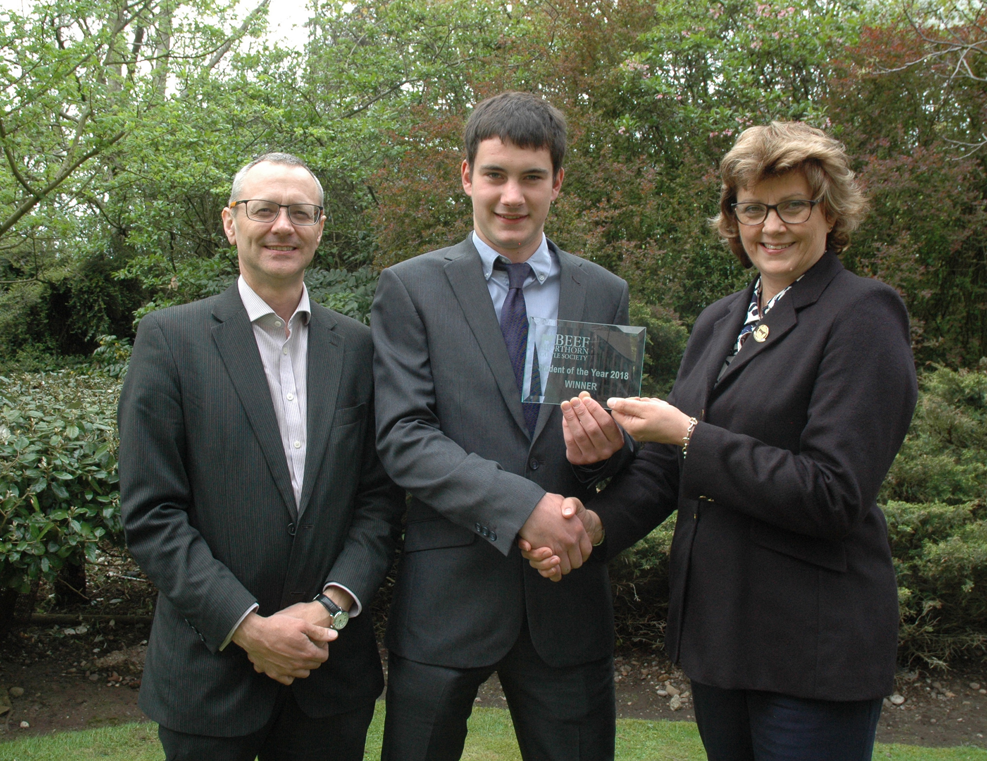 Beef Student of the Year, Henry Scholefield receives his award from Beef Shorthorn Cattle Society president, Sally Horrell, with Course Tutor, Prof Paul Wilson