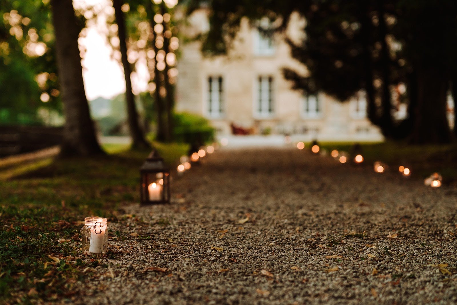A path with candles on it, perfect for a romantic evening at a French chateau.